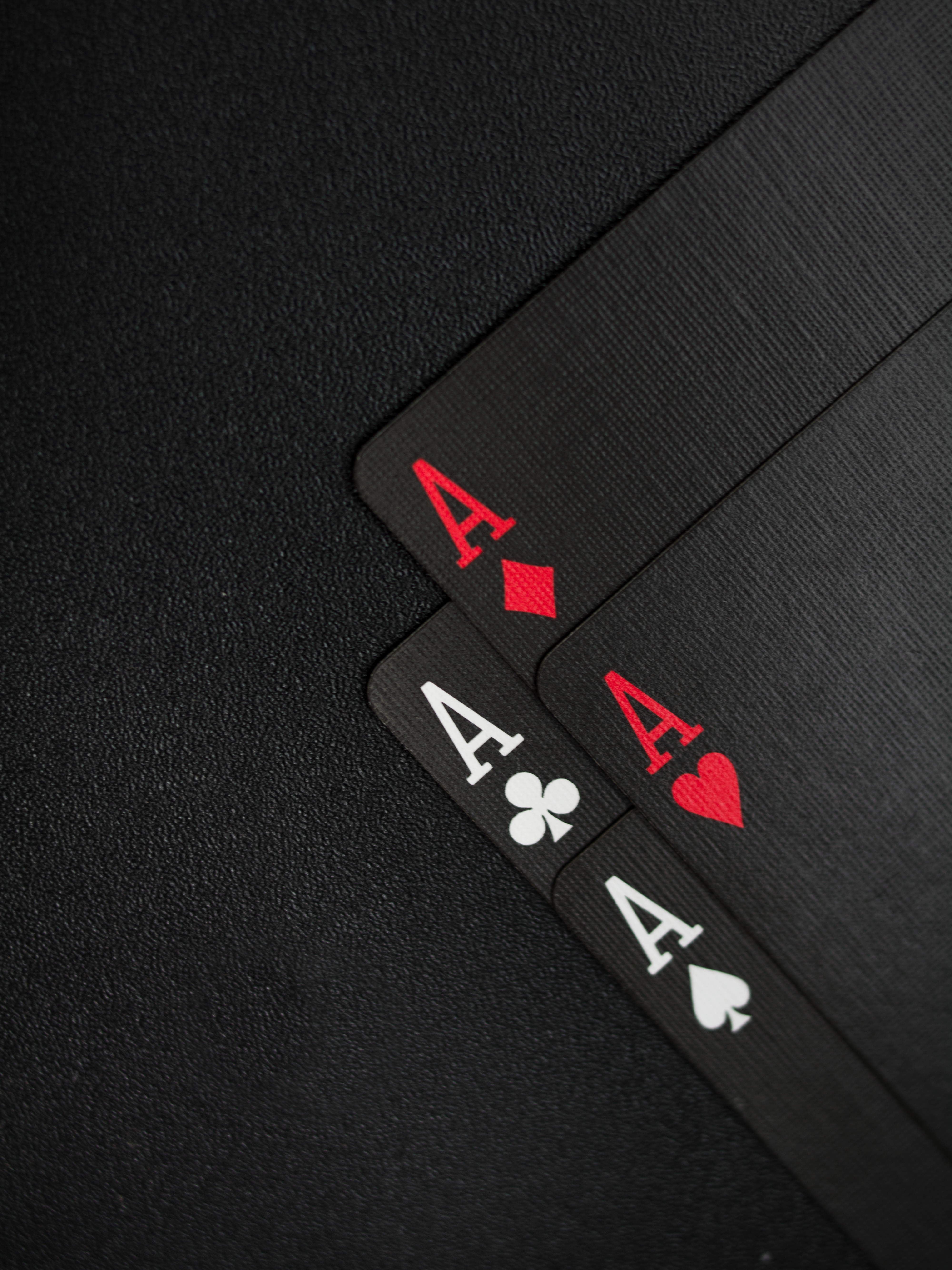 Black Playing Cards on Black Background · Free