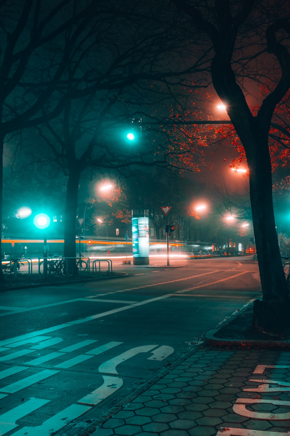A city street at night with street lights photo