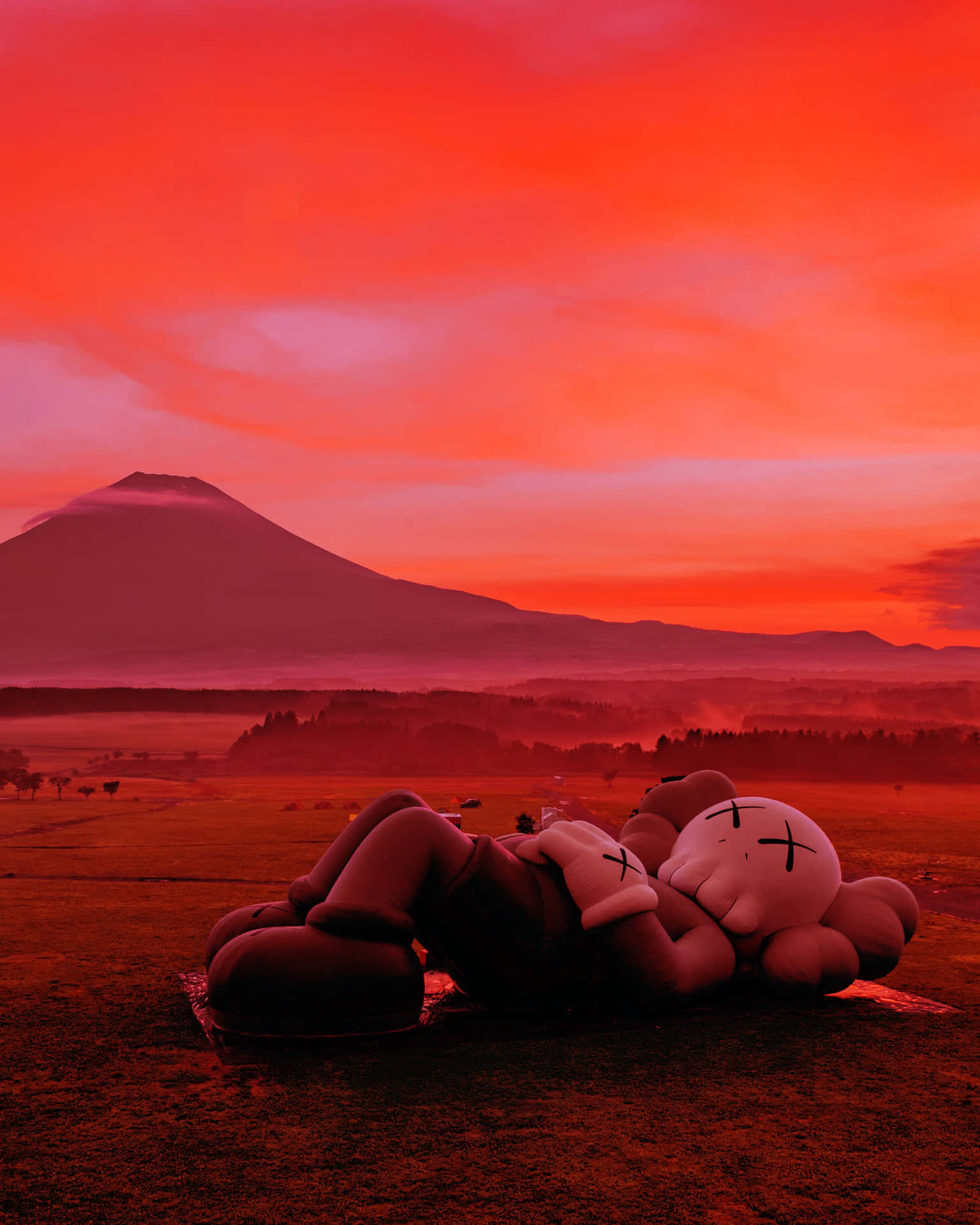Download Pop artist KAWS' artwork showcased in bold colors Wallpaper