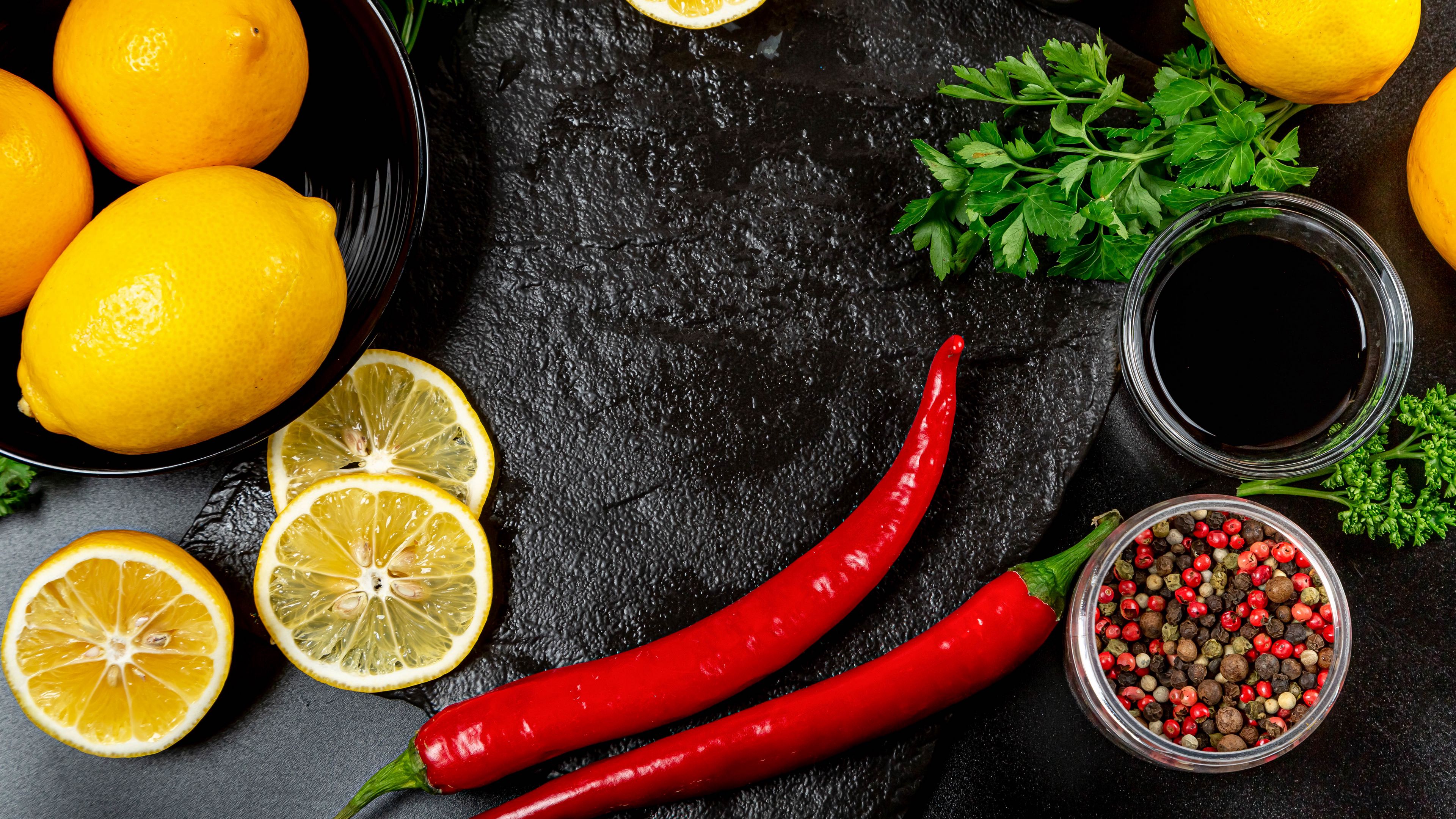 Download wallpaper 3840x2160 lemon, slices, citrus, pepper, parsley, cooking 4k uhd 16:9 HD background