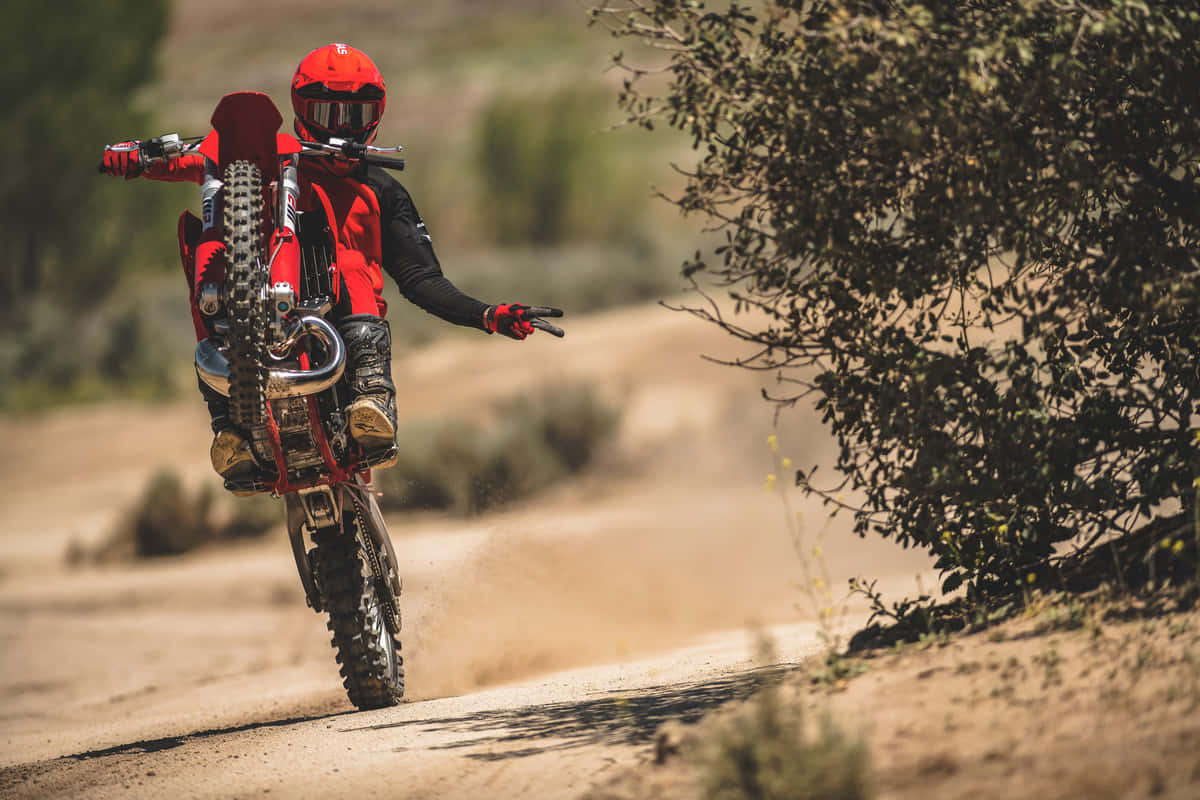 Download A Thrilling Ride On A Gas Gas Dirt Bike Wallpaper