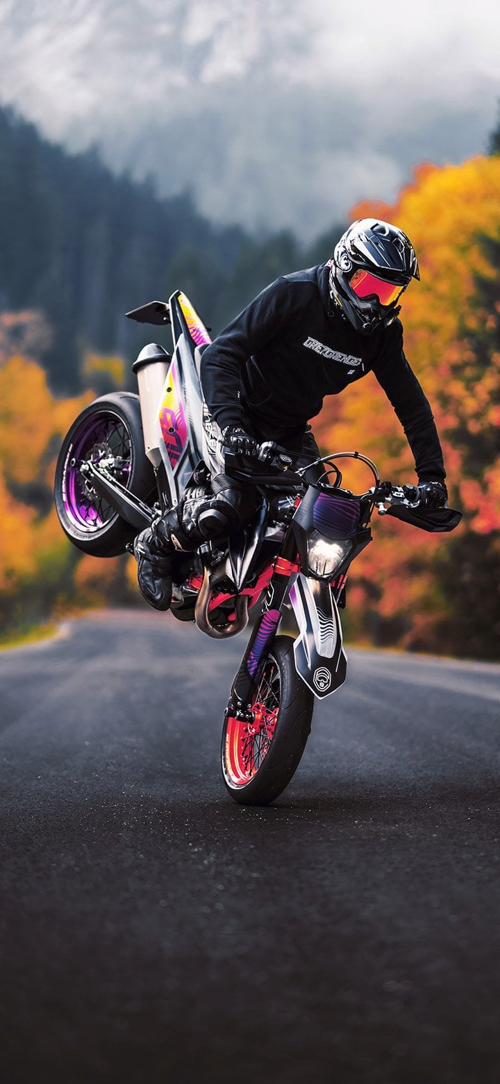 Man Performing Stoppie Stunt On A Motorcycle 4K phone wallpaper [2610x5655] and [1080x2340]