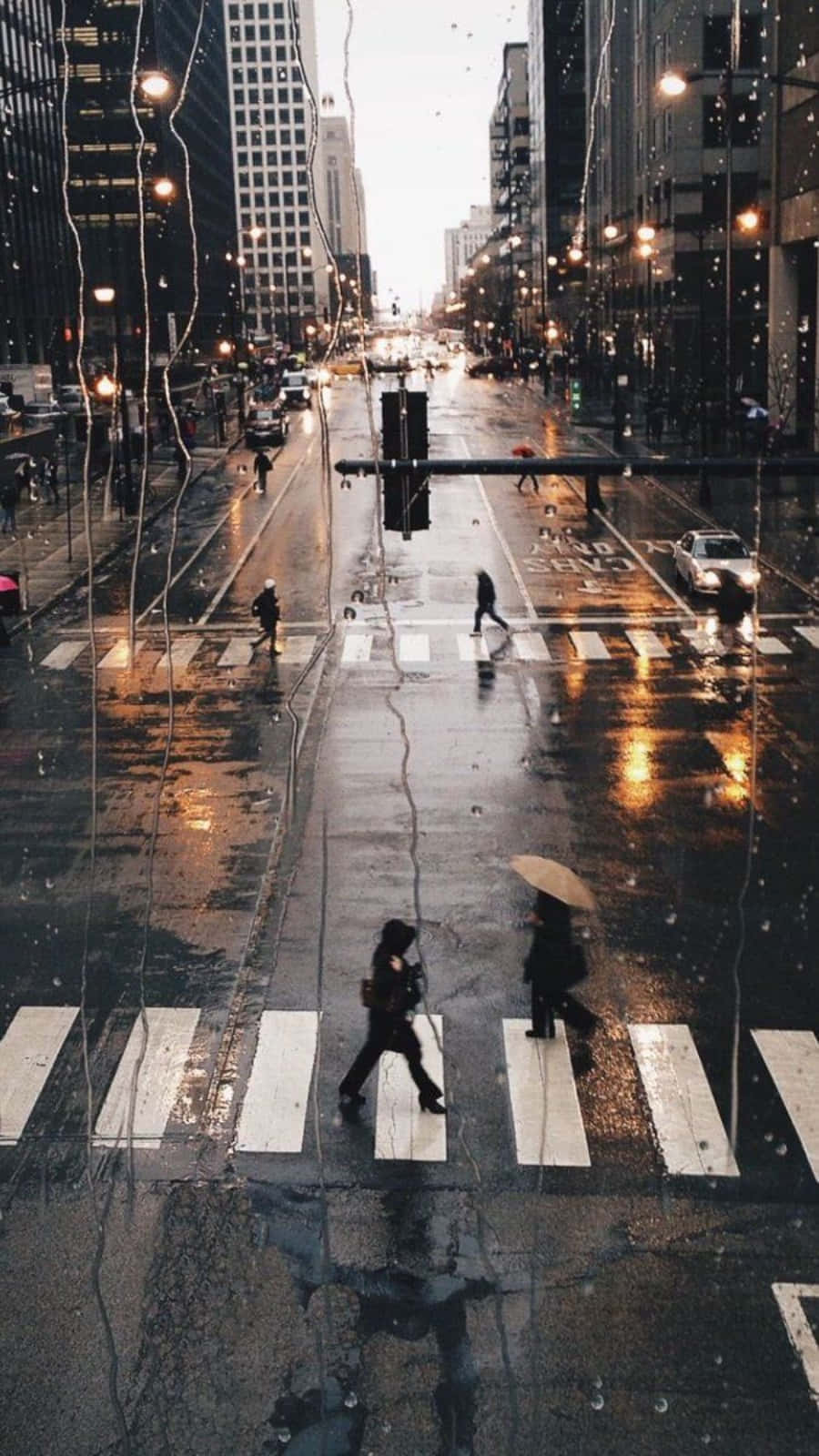 Download Aesthetic Rain On Wet City Roads Wallpaper