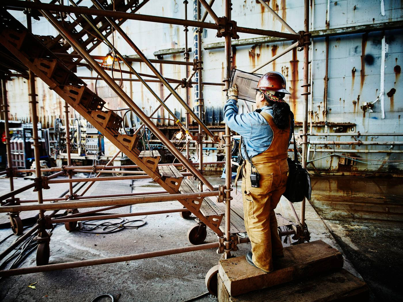 Men Working on a Construction Site while Wearing Hard Hats · Free