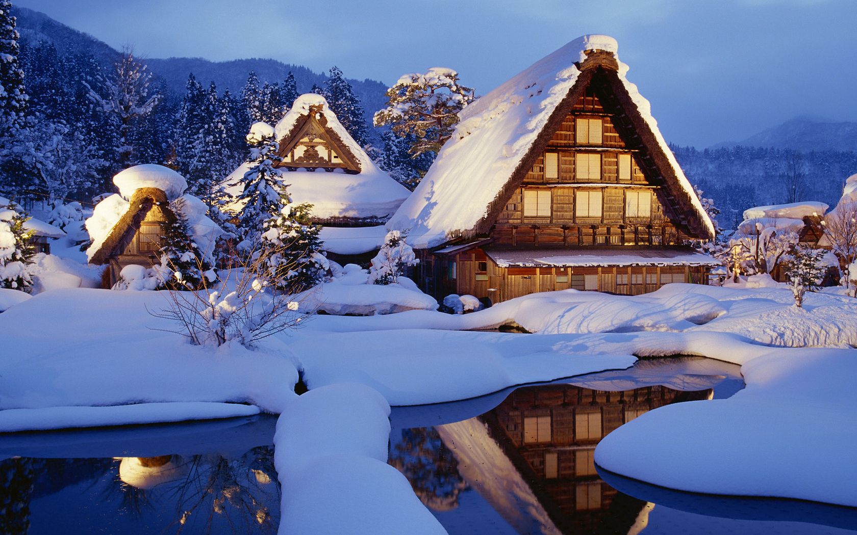 Download wallpaper 1680x1050 winter, snow, lodges, lake, light, reflection, japan HD background