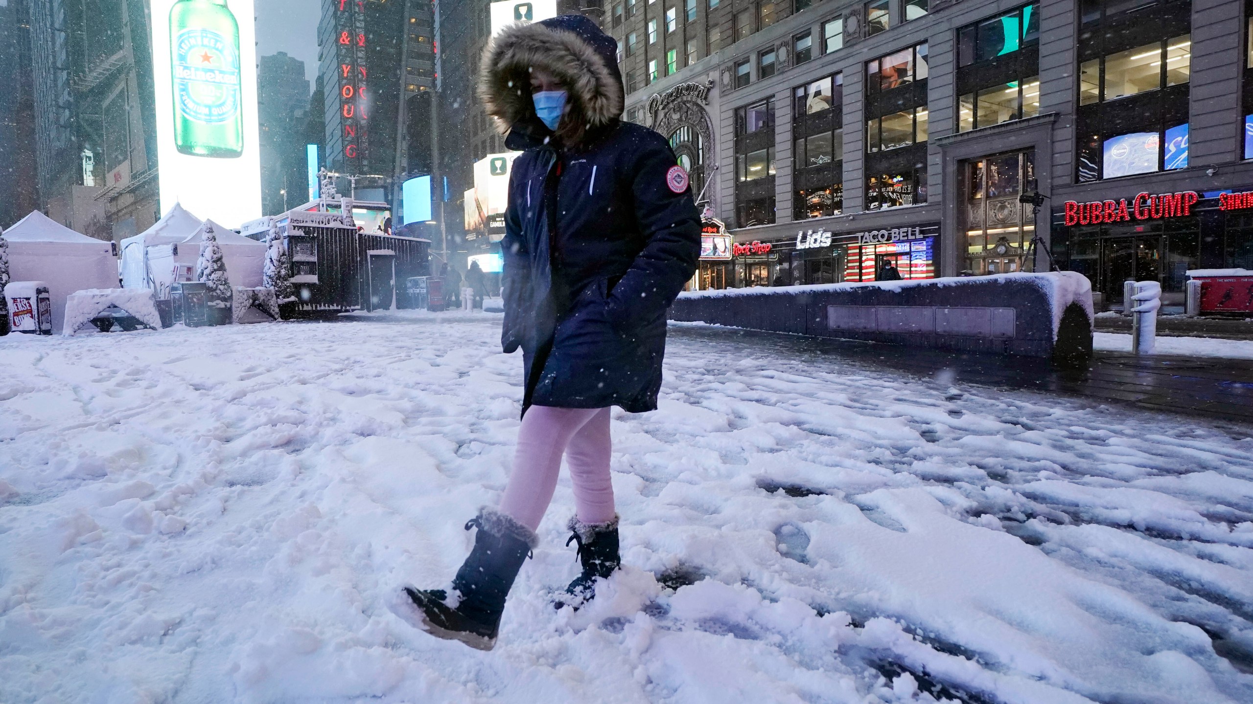Winter storm snarls travel, gives some schools the day off