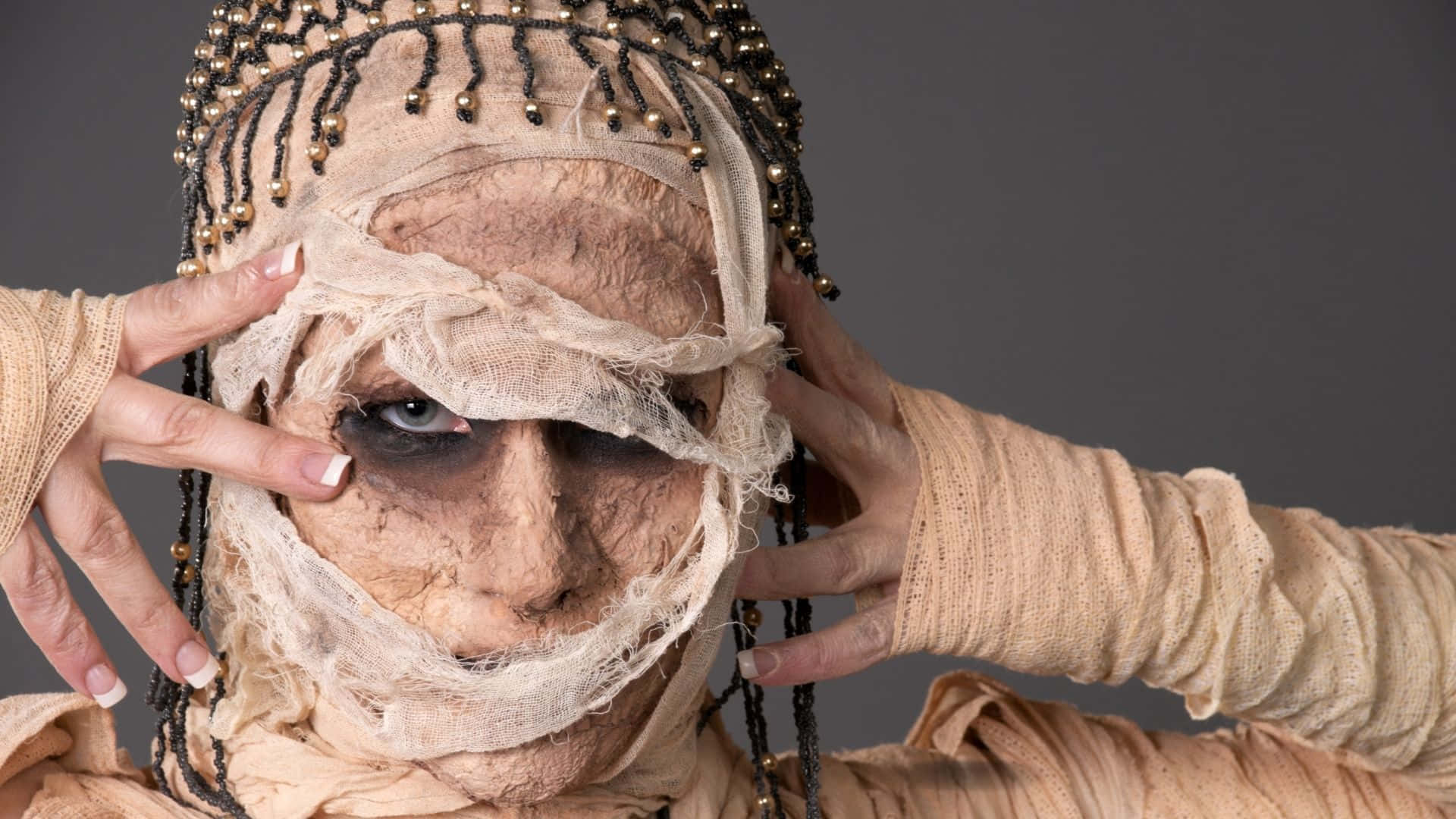 Download Make Your Halloween Spookier This Year with a Mummy Costume! Wallpaper
