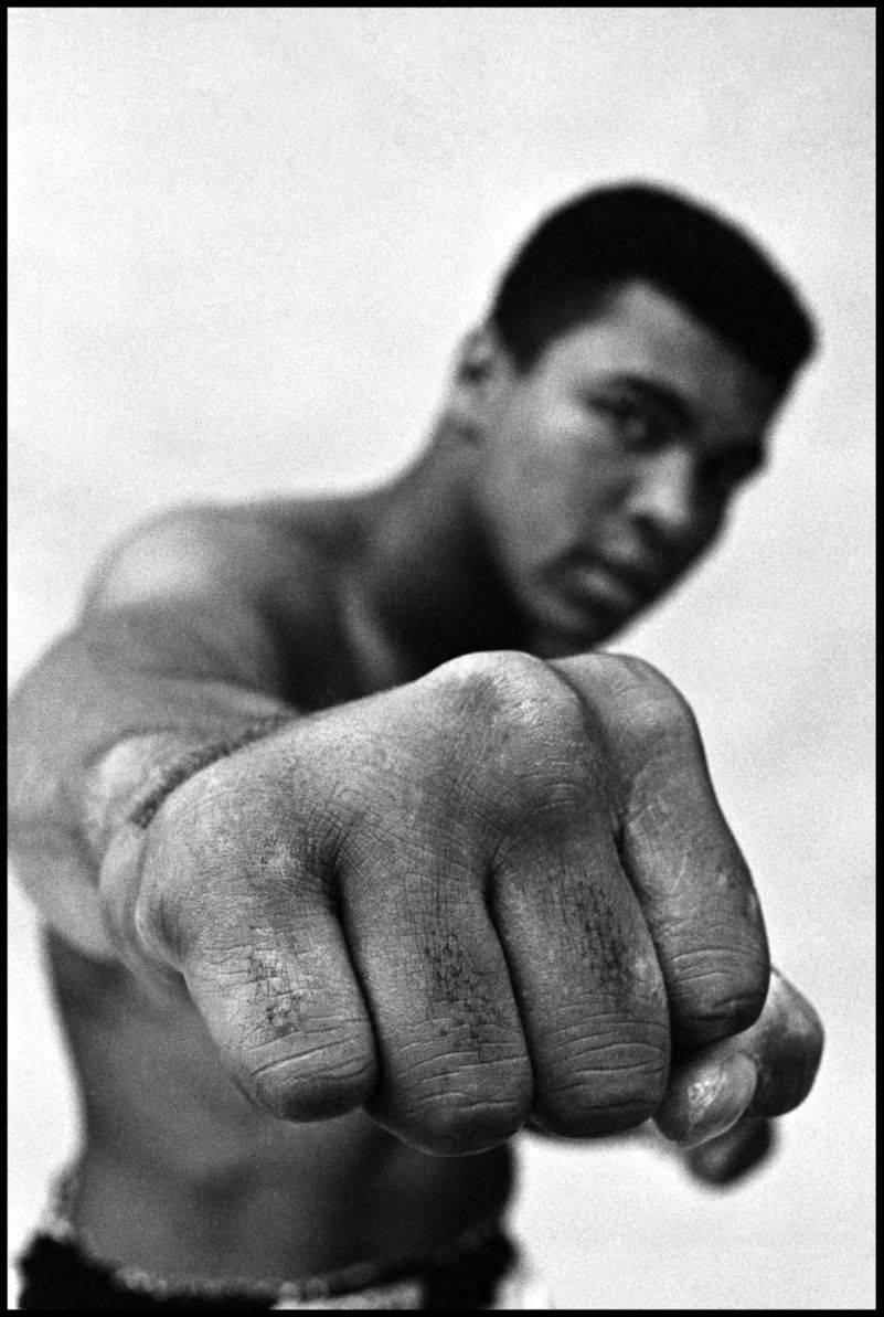Download The Legend, Muhammad Ali, Flexing His Muscles Wallpaper
