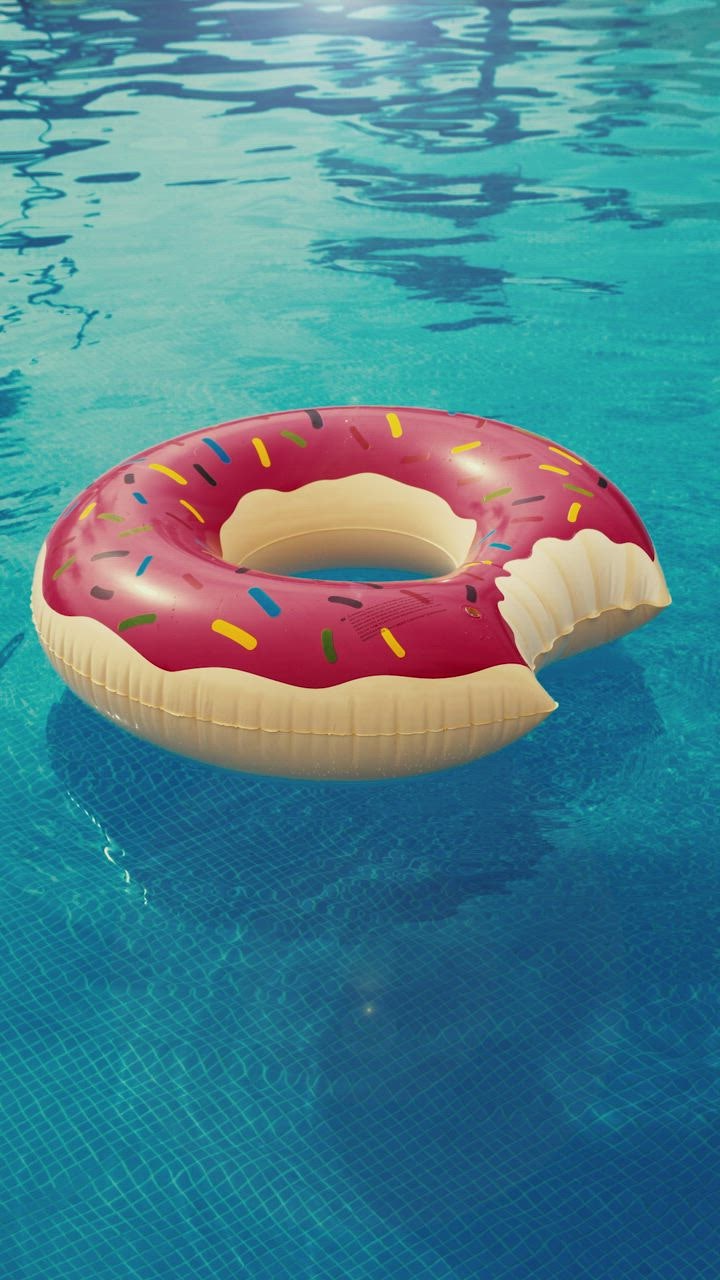 Inflatable pool ring floating in a pool Stock Video