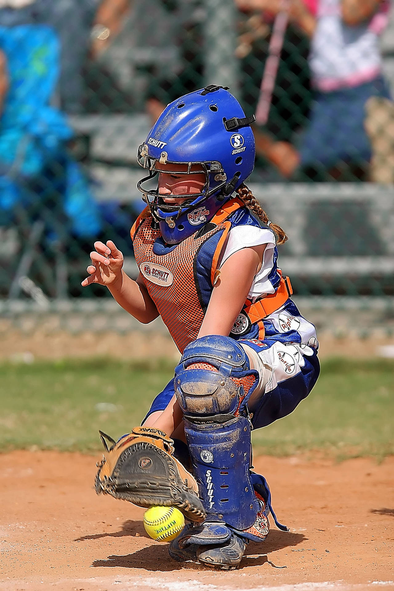 Download Softball Player With Dirt Covered Uniform Wallpaper