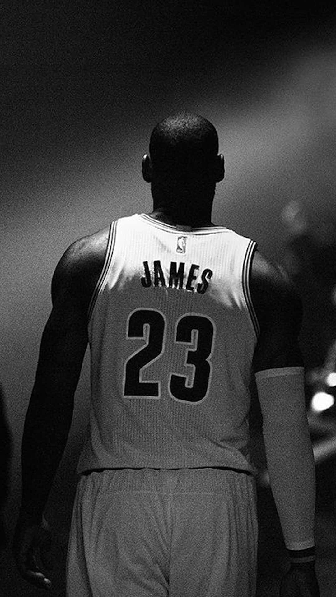 Download Lebron James holding the latest iPhone Wallpaper