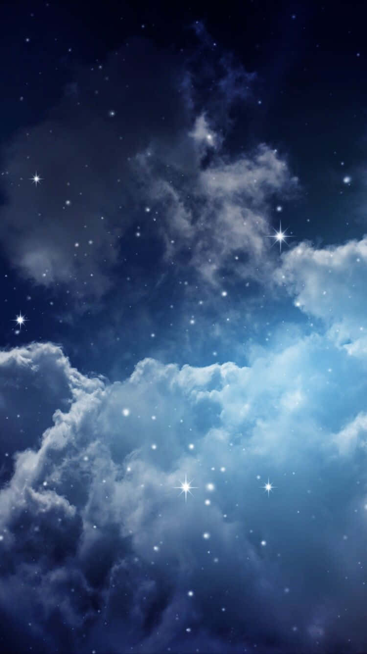 Download Magical Night Sky With Many Stars Shining On Large Clouds Wallpaper