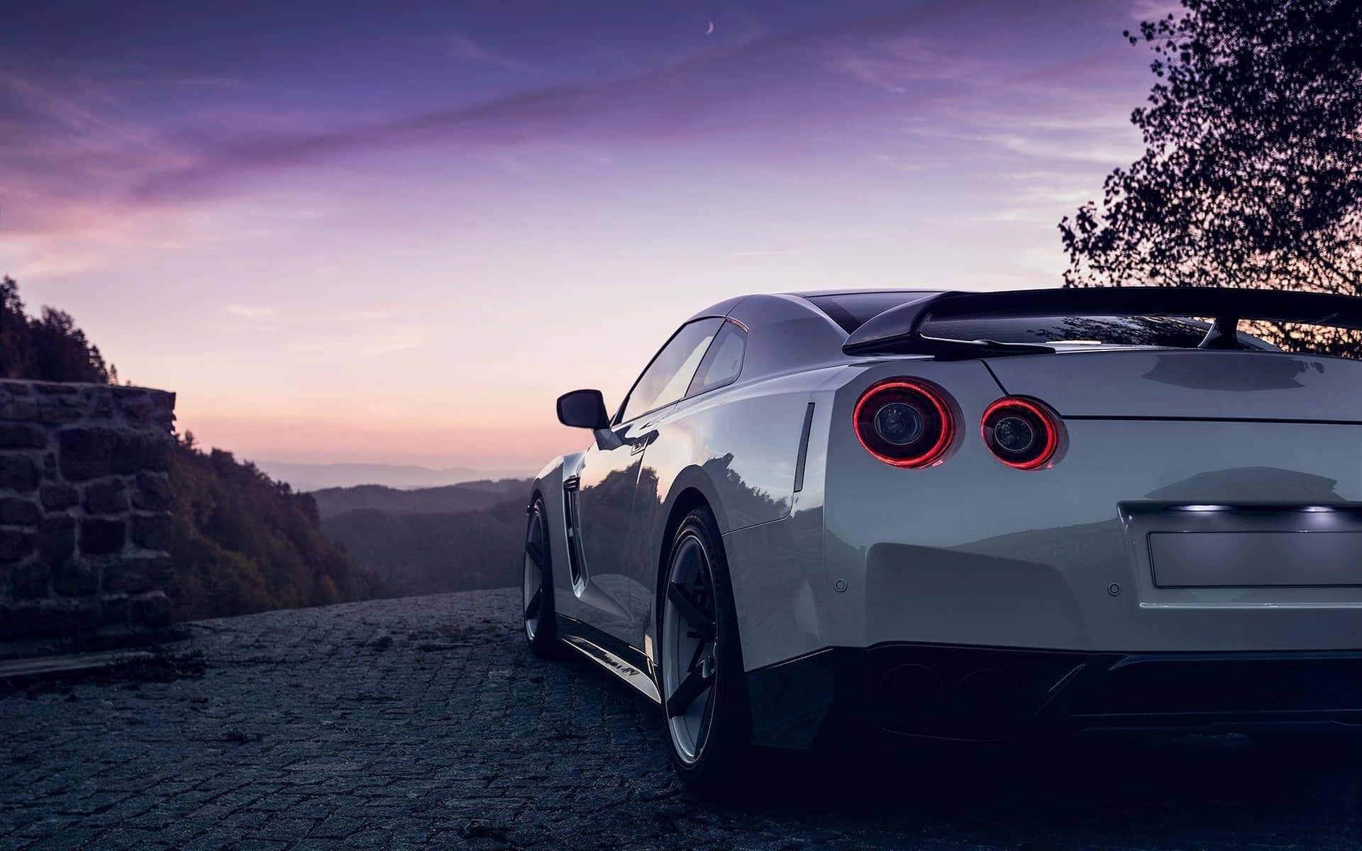 Download White Gt R Desktop Overlooking Sunset Wallpaper