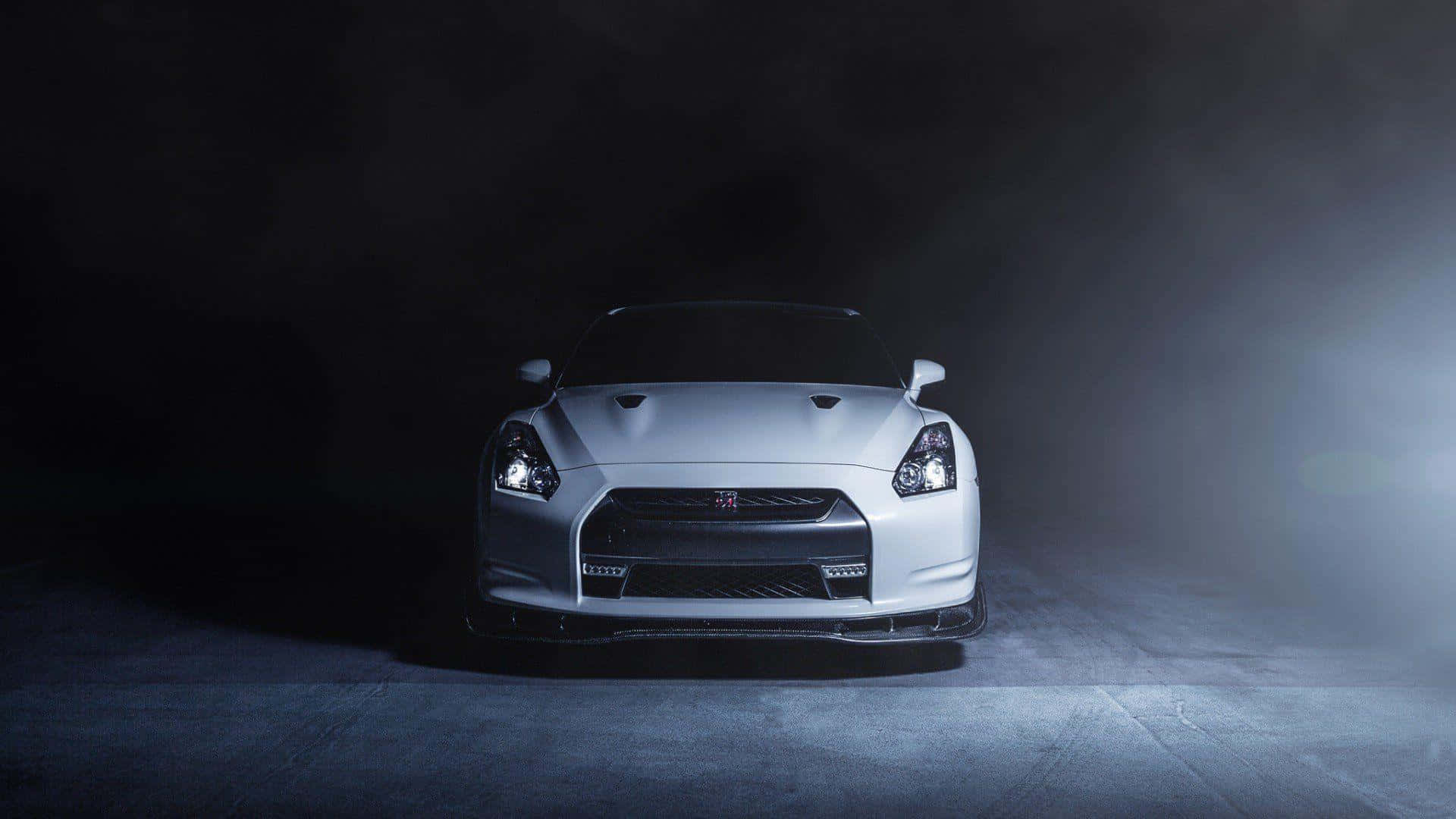Download Get The Thrill Of A Lifetime Behind The Wheel In A Nissan Gtr. Wallpaper