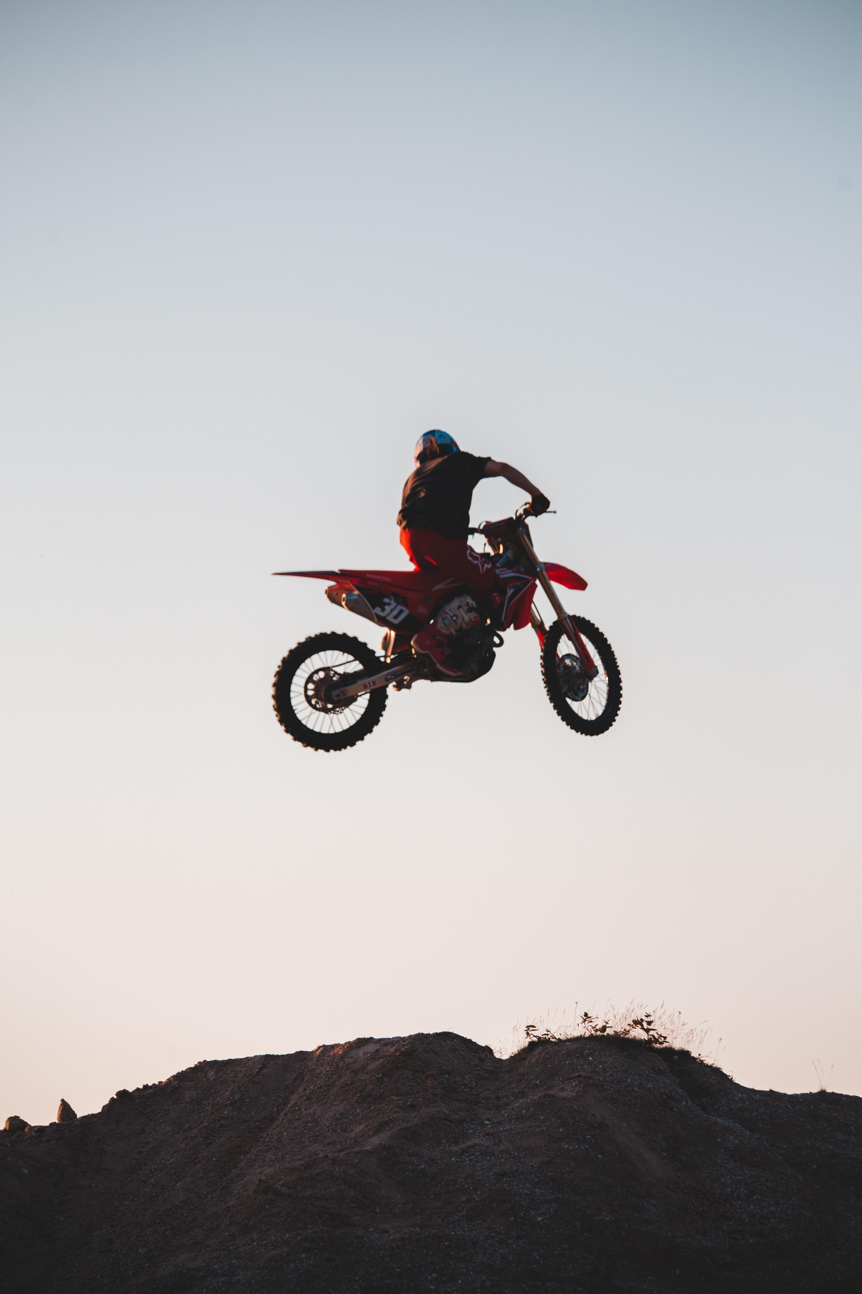 Man Riding a Dirt Bike Jumping on ta Ramp · Free