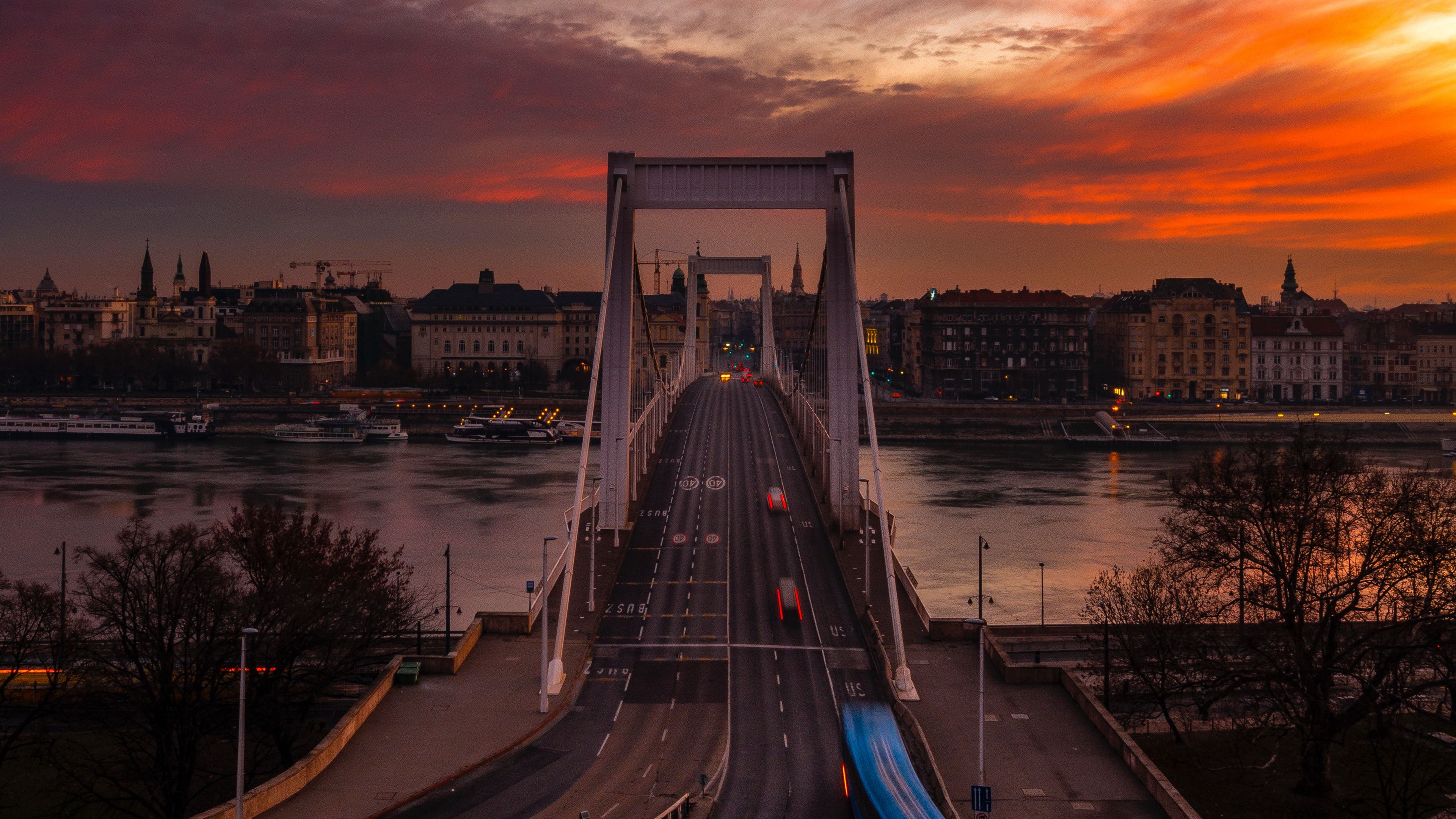 Download wallpaper 3840x2160 bridge, sunset, city, budapest, hungary 4k uhd 16:9 HD background