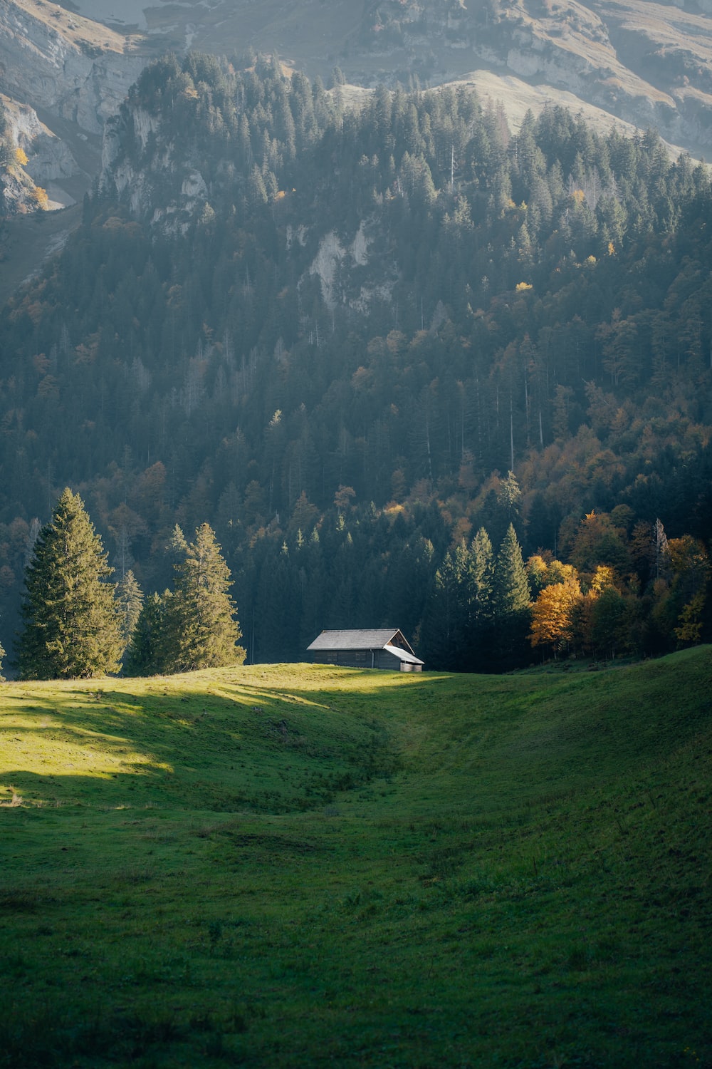 A house in a valley between mountains photo