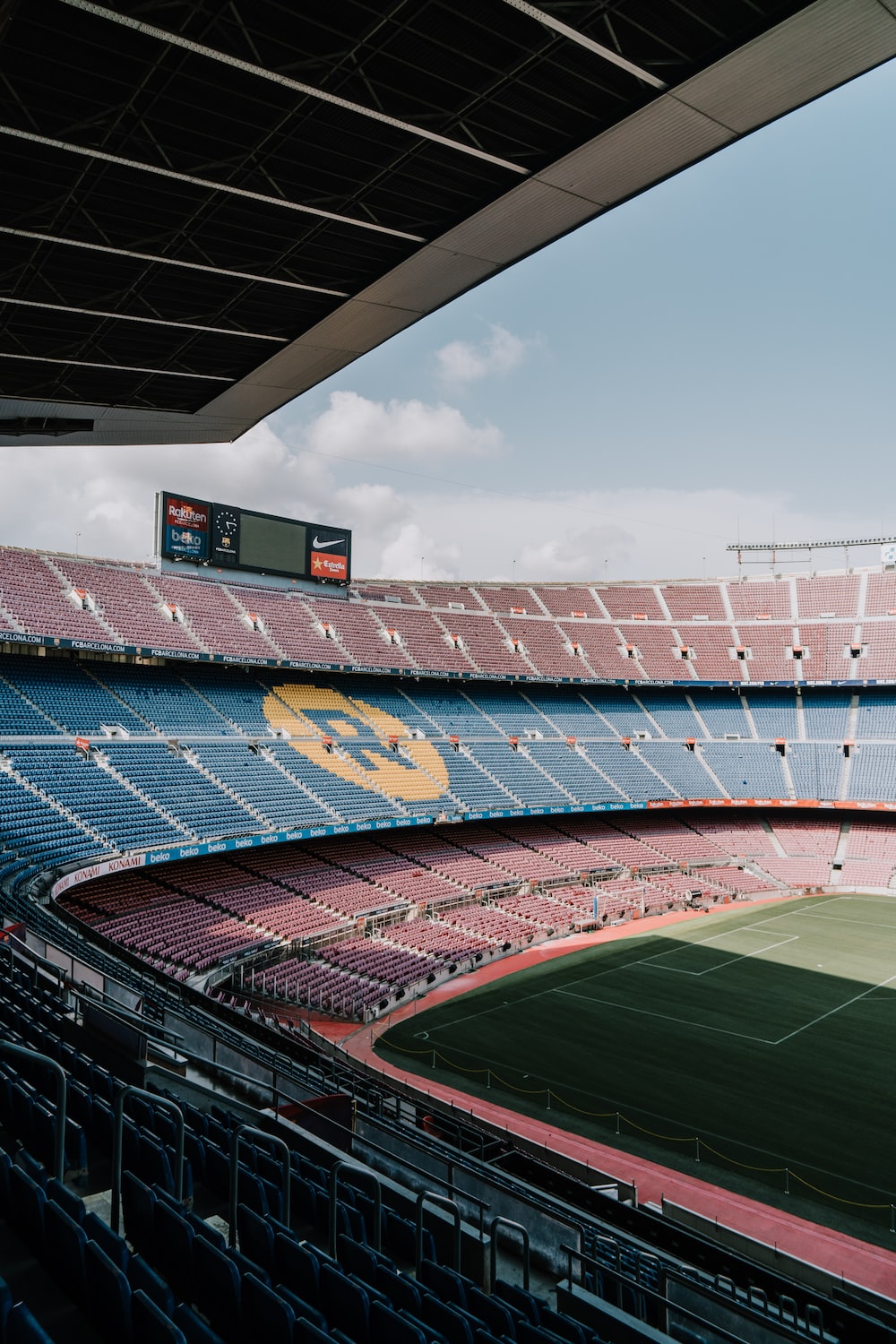 Blue and red stadium under blue sky during daytime photo