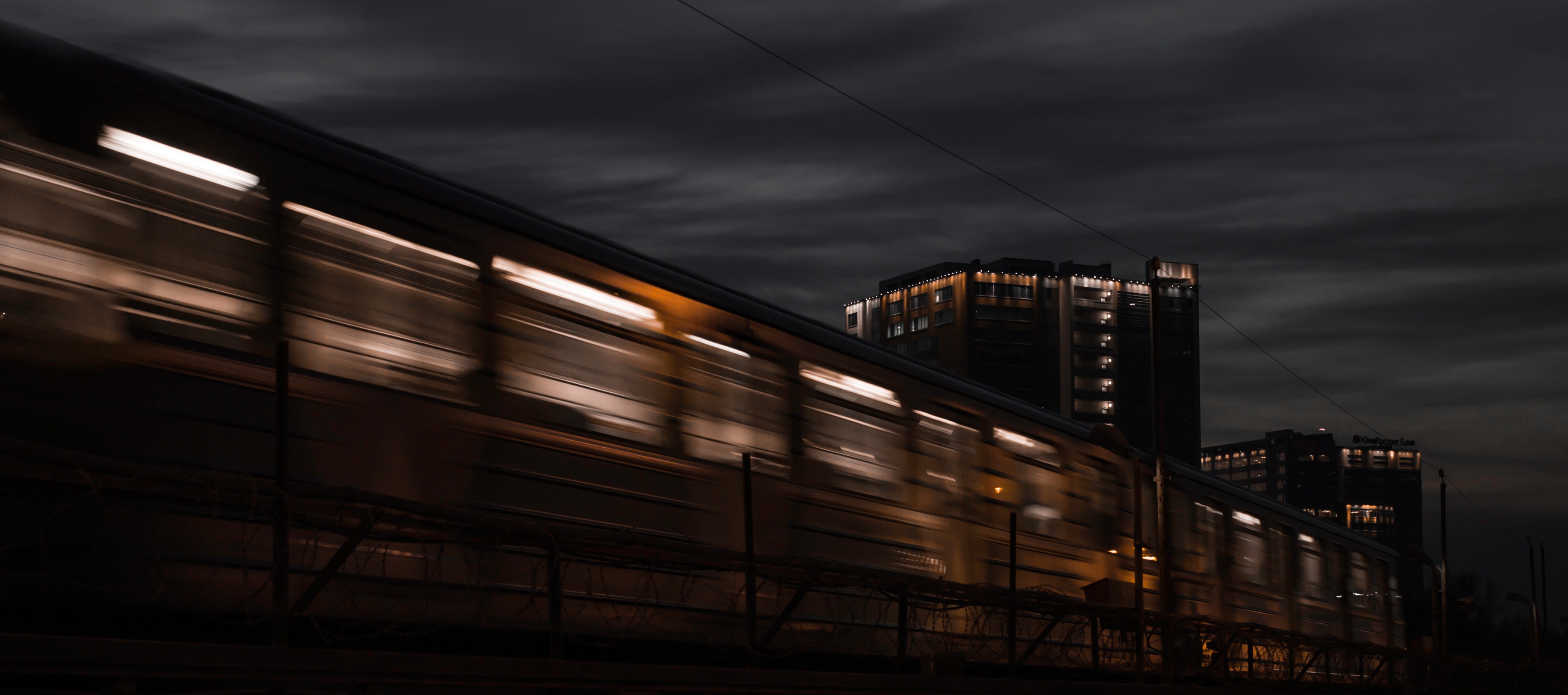 Download wallpaper 4134x1832 train, dark, long exposure, night, motion HD background