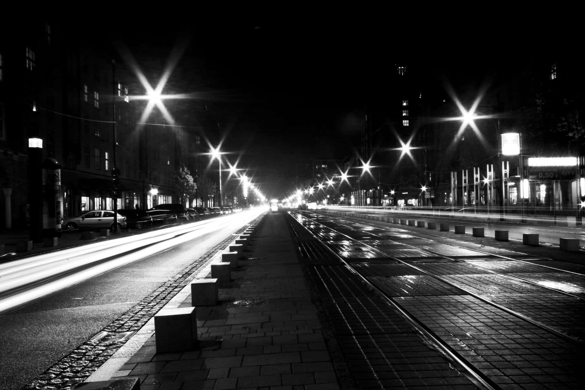 Download Black and white street scene in a bustling city Wallpaper