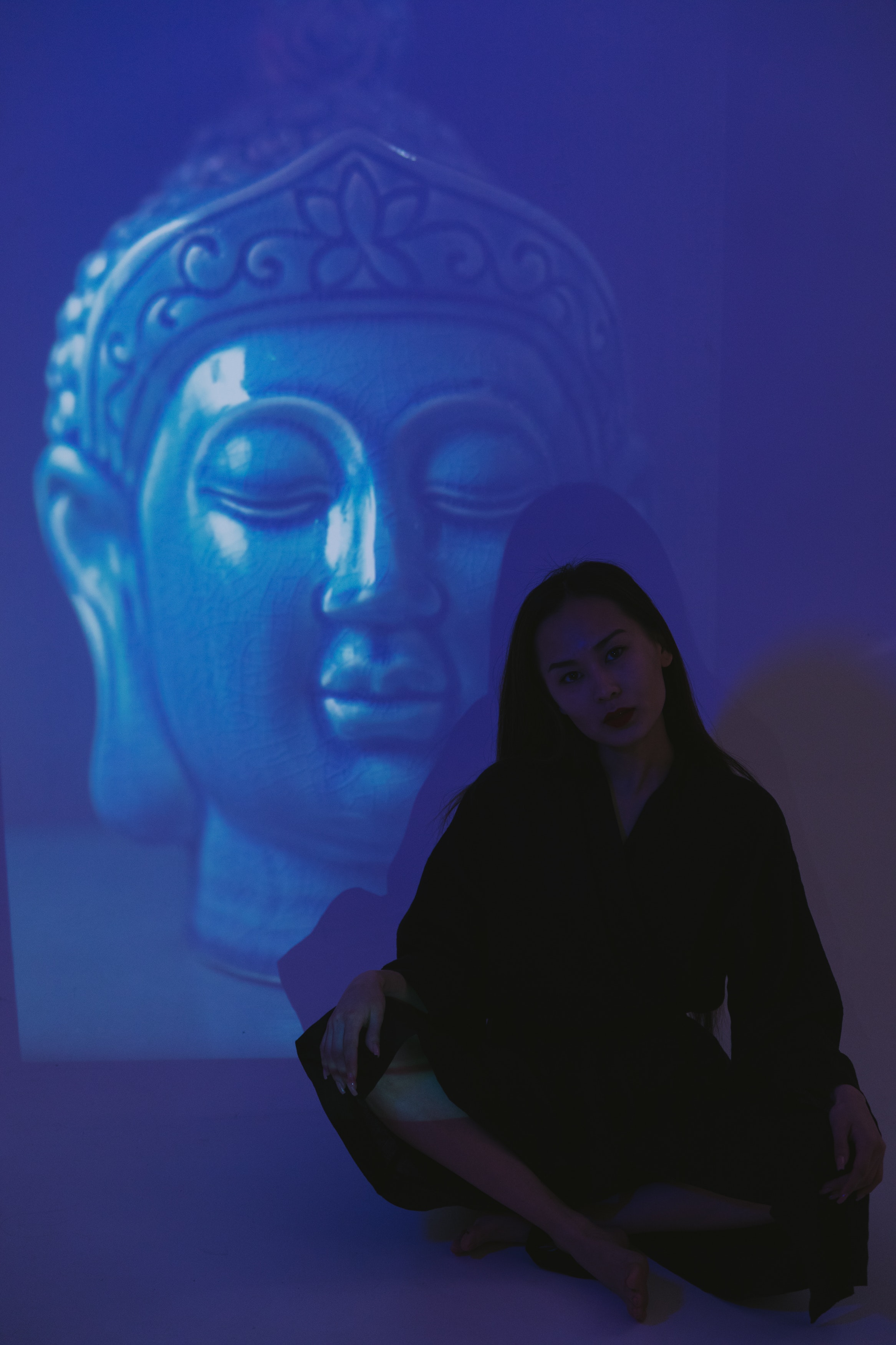 A Gray Buddha on Dark Background · Free