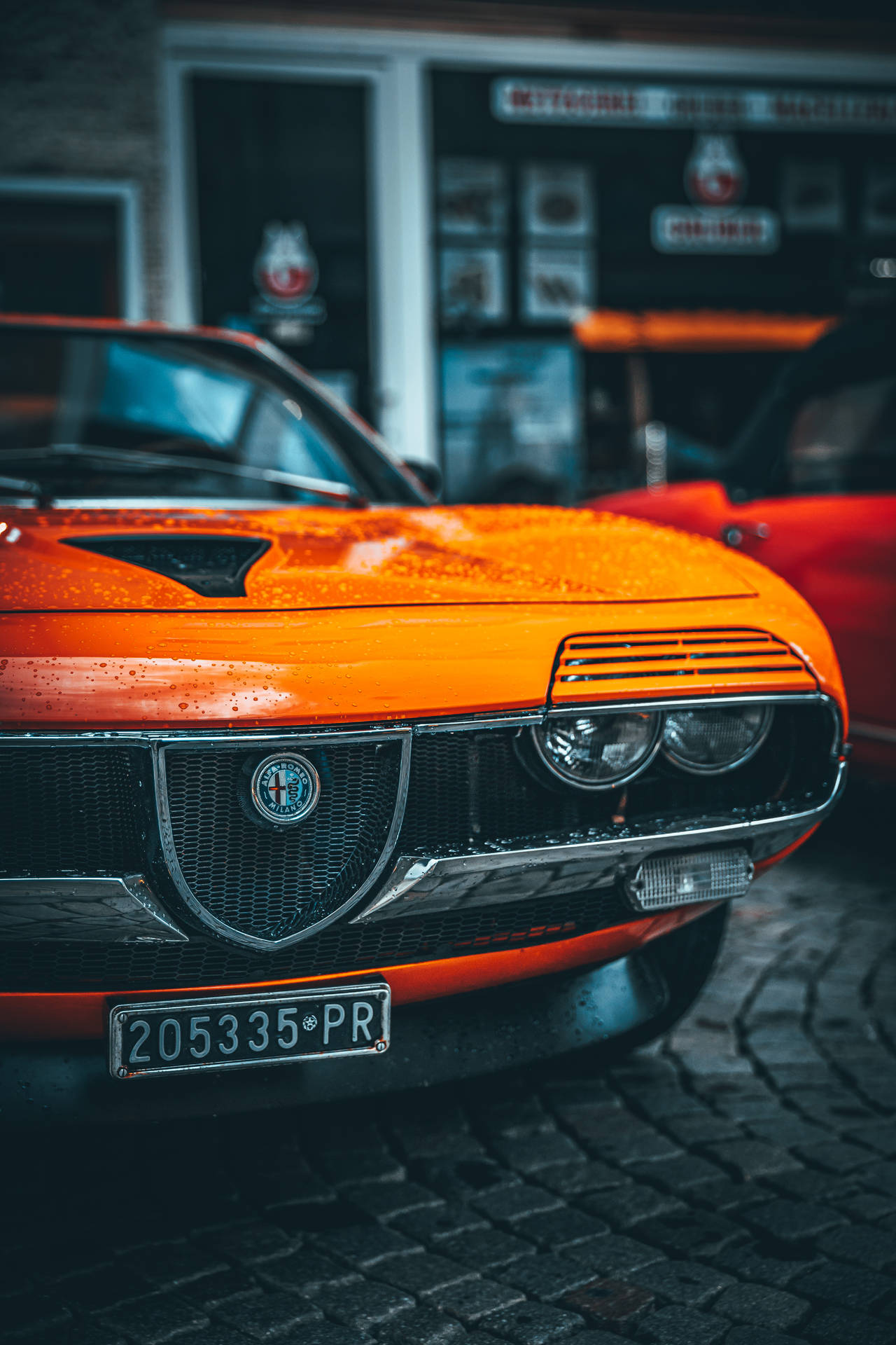 Download Feel the Power of an Italian Legend in the Alfa Romeo Montreal Wallpaper