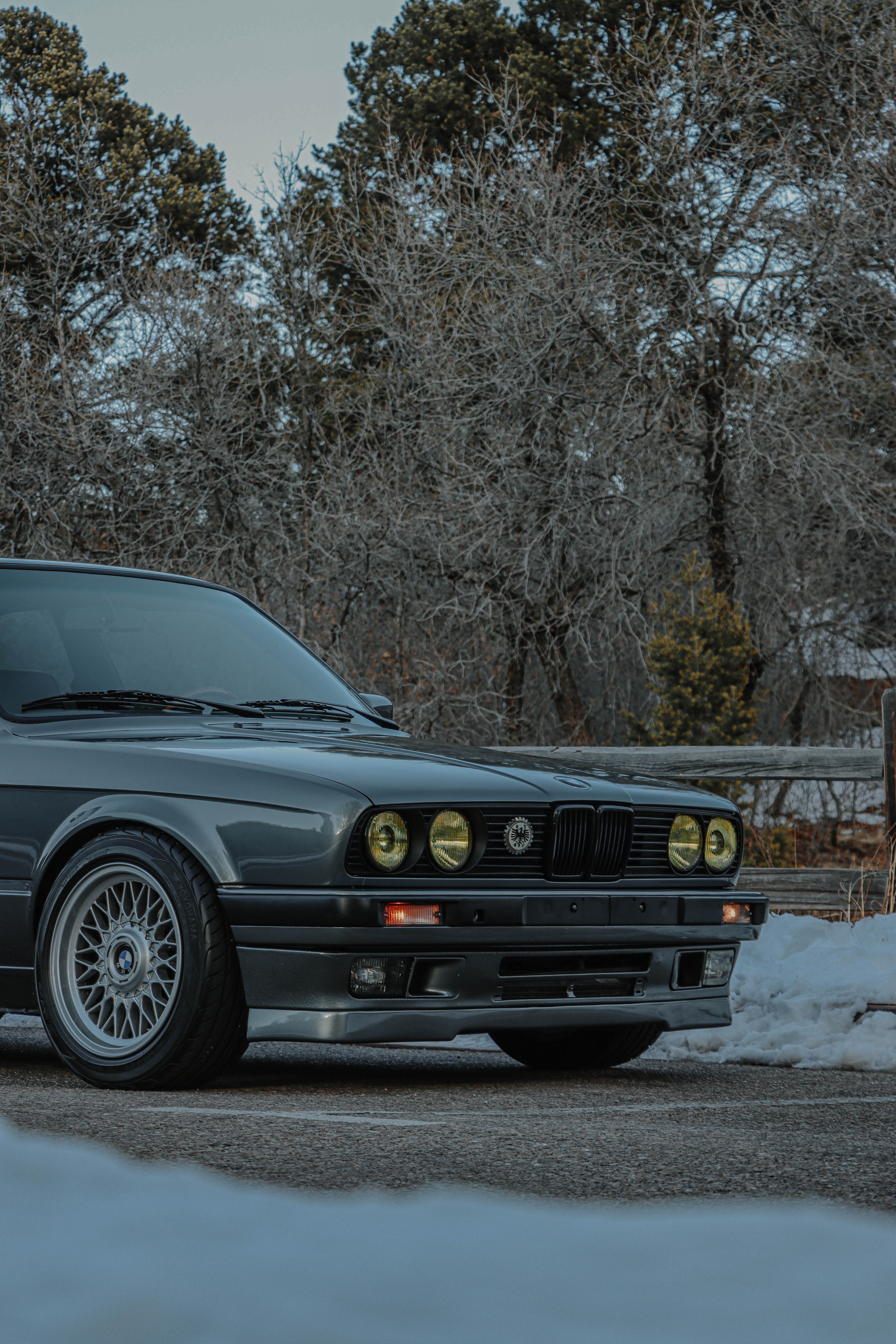 Parked BMW E30 on Pavement · Free