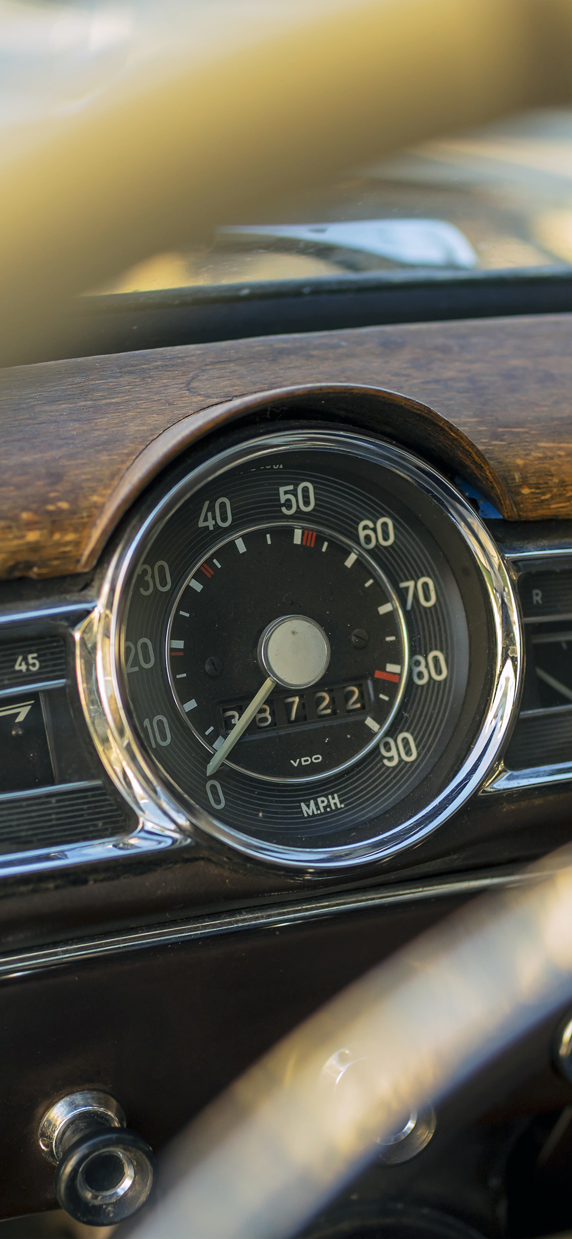 iPhone X wallpaper. driver seat car vintage bokeh