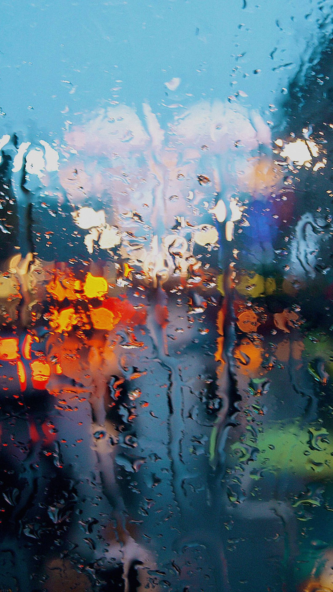 rain falling softly outside a window