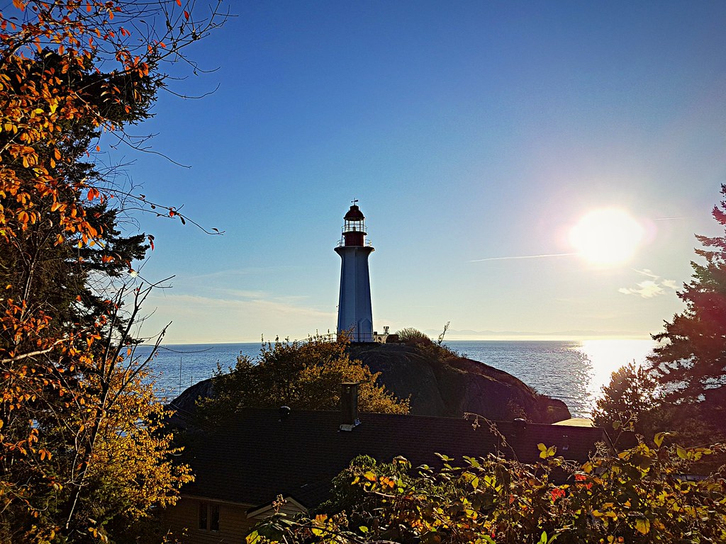 Lighthouse, sun, sea and autumn leaves. In Lighthouse Park