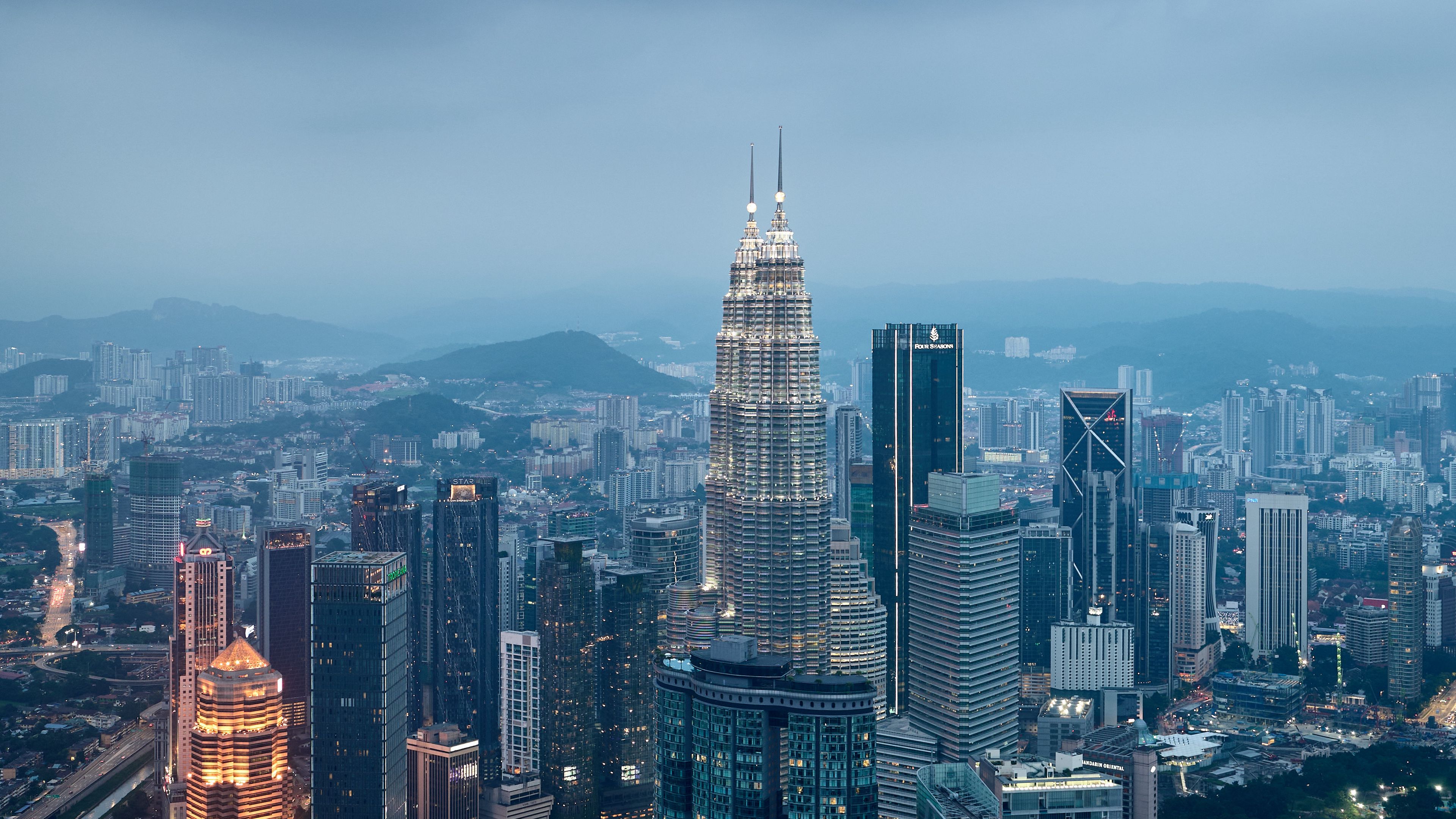 Download wallpaper 3840x2160 buildings, skyscrapers, city, evening, kuala lumpur, malaysia 4k uhd 16:9 HD background