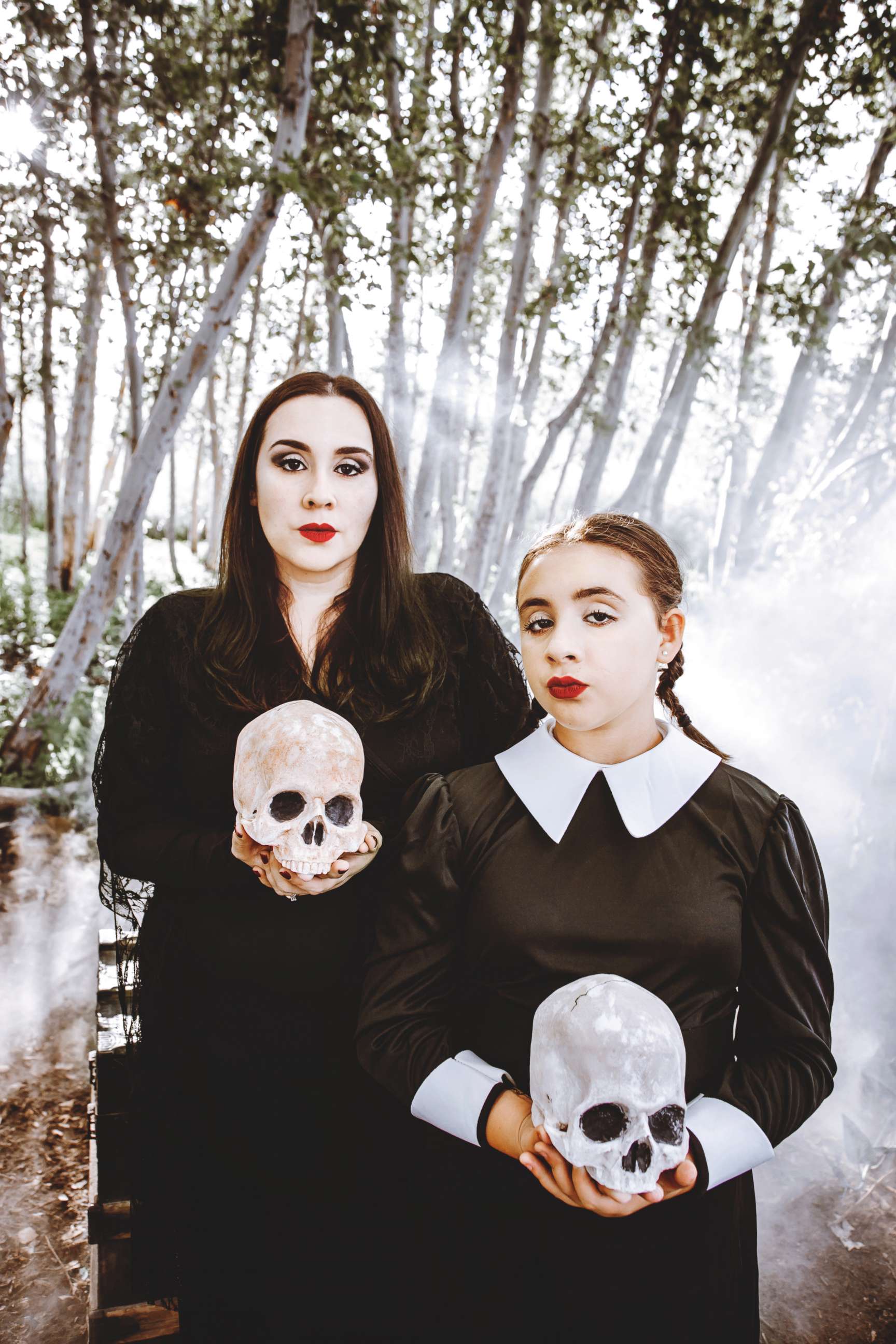 Family poses for creepy, kooky 'Addams Family'-themed Halloween photo