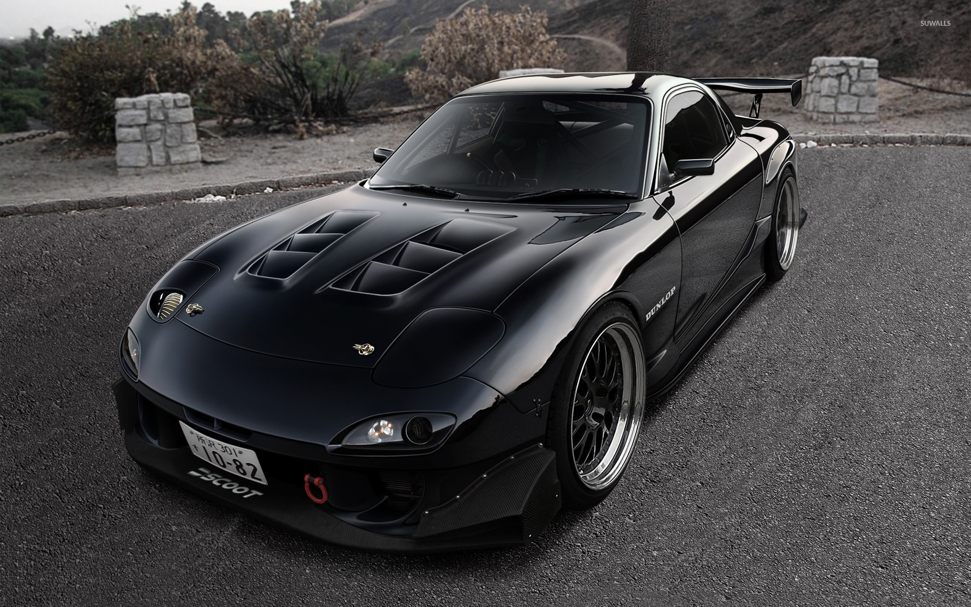 Front Side View Of A Mazda RX 7 Wallpaper Wallpaper