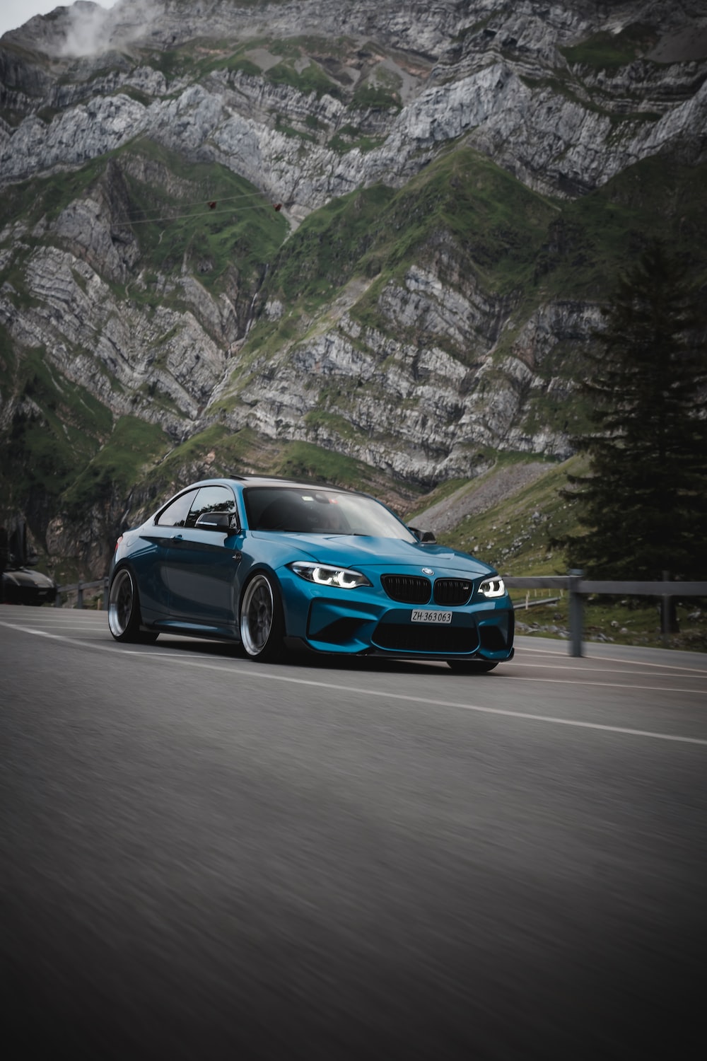 Blue bmw m 3 on road during daytime photo