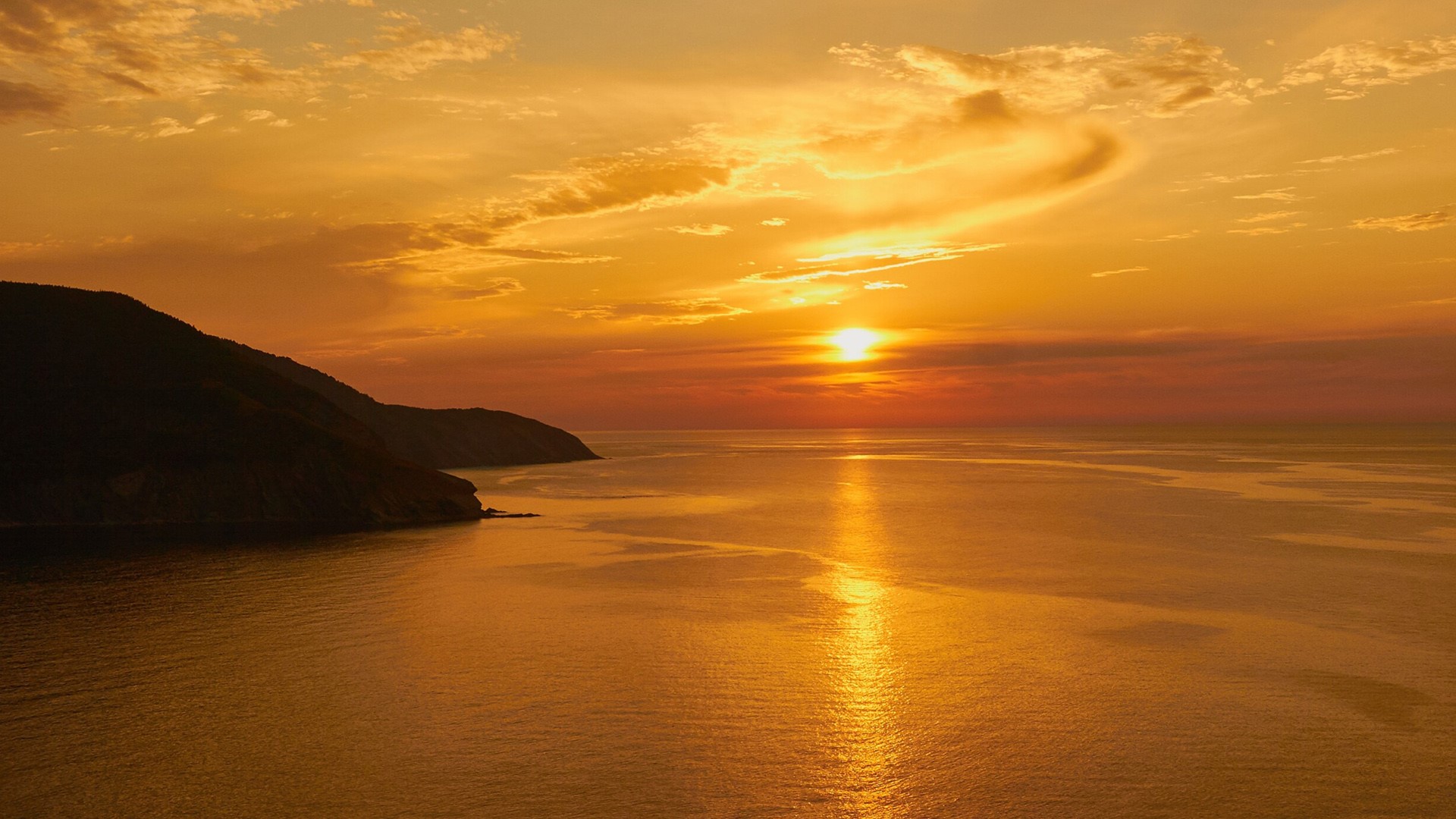 Sunset over the coast of Cape Breton Island, Nova Scotia, Canada. Windows Spotlight Image