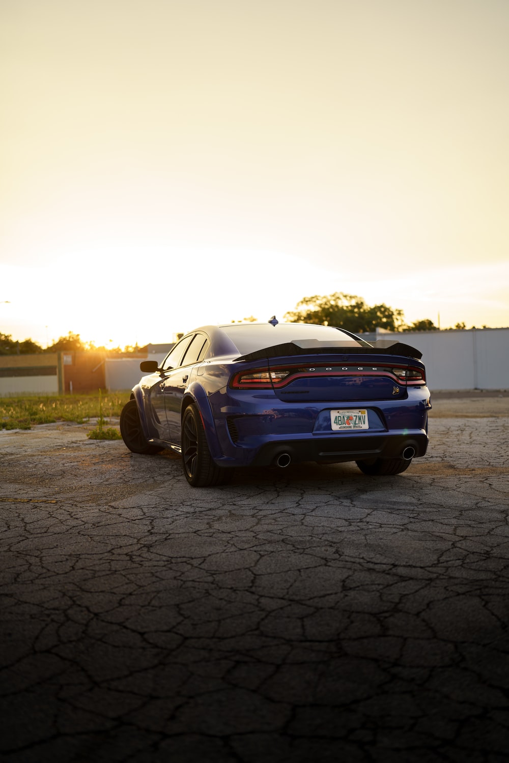 A blue car parked on a brick road photo