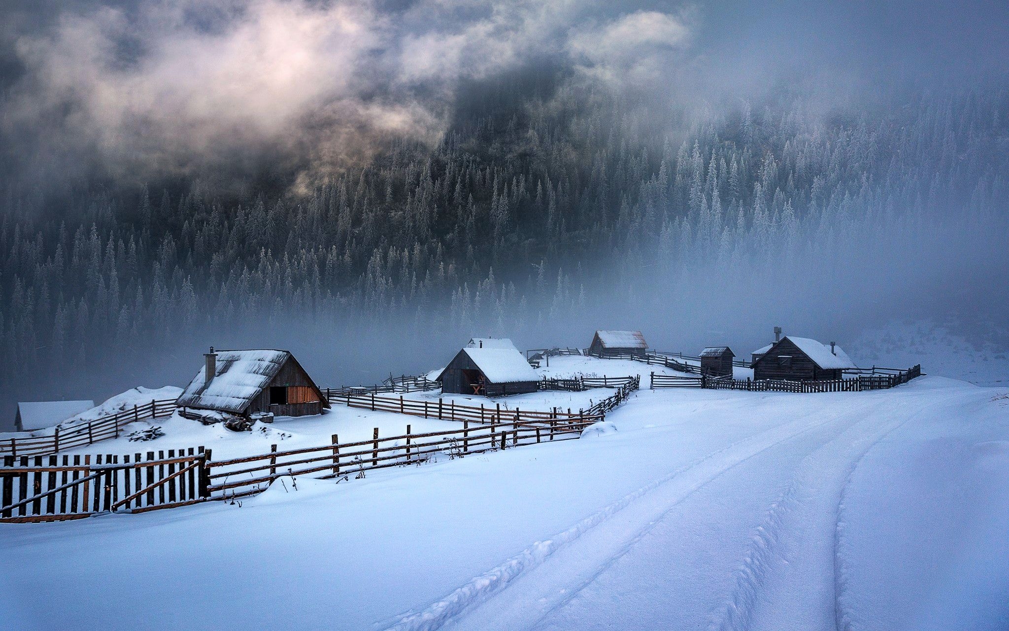 Misty Winter Village in the Mountains