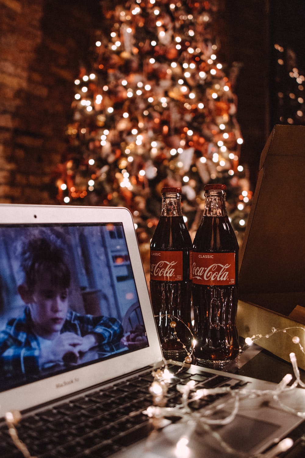 Coca cola bottle beside white ipad photo