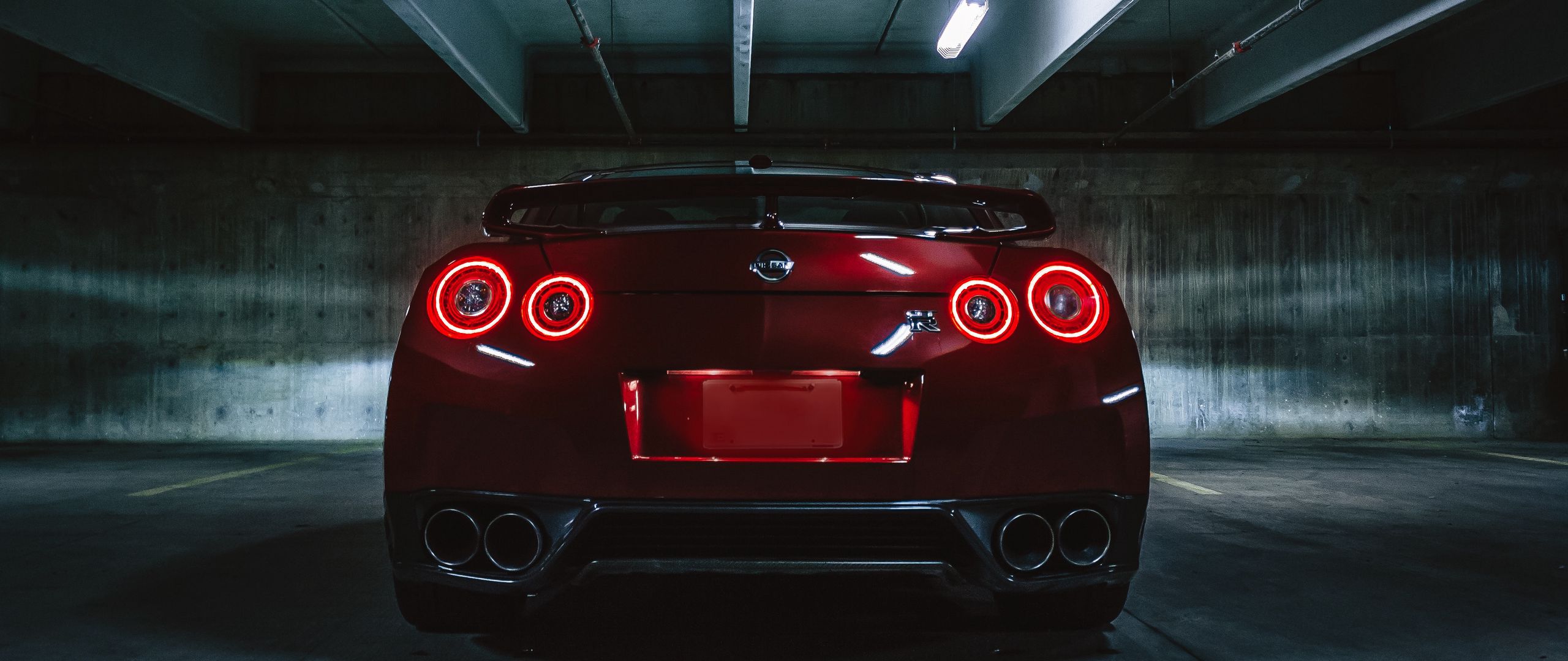 Download wallpaper 2560x1080 nissan gtr, nissan, headlights, rear view, dark dual wide 1080p HD background