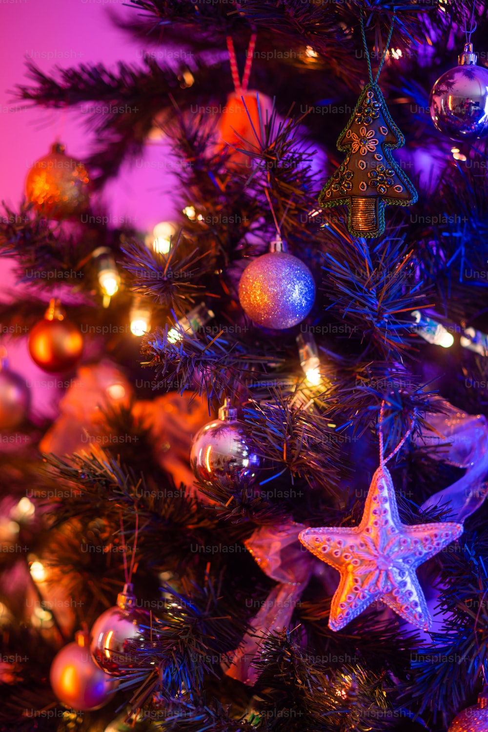 A close up of a christmas tree with ornaments photo
