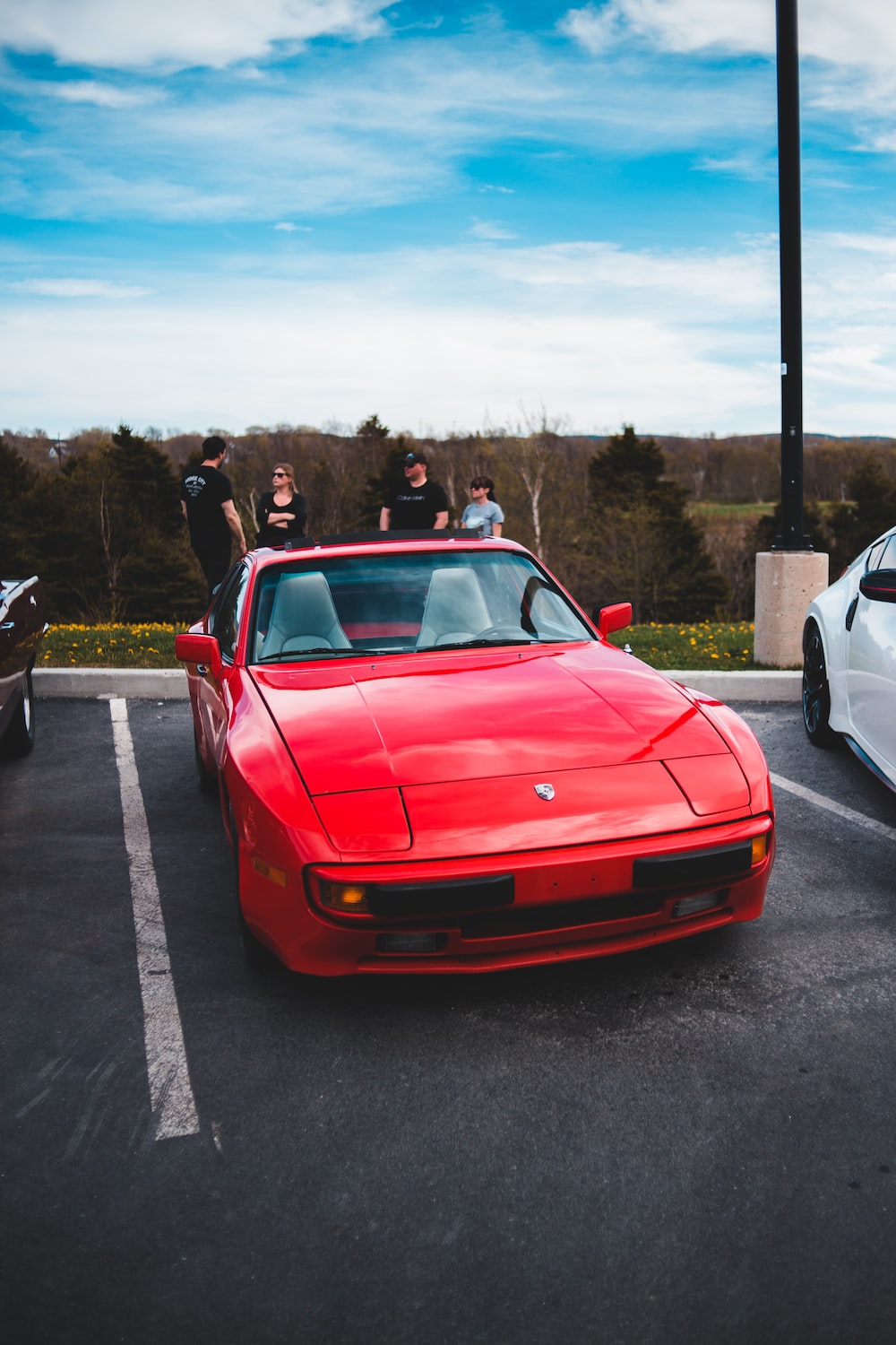 Red ferrari sports car on road during daytime photo