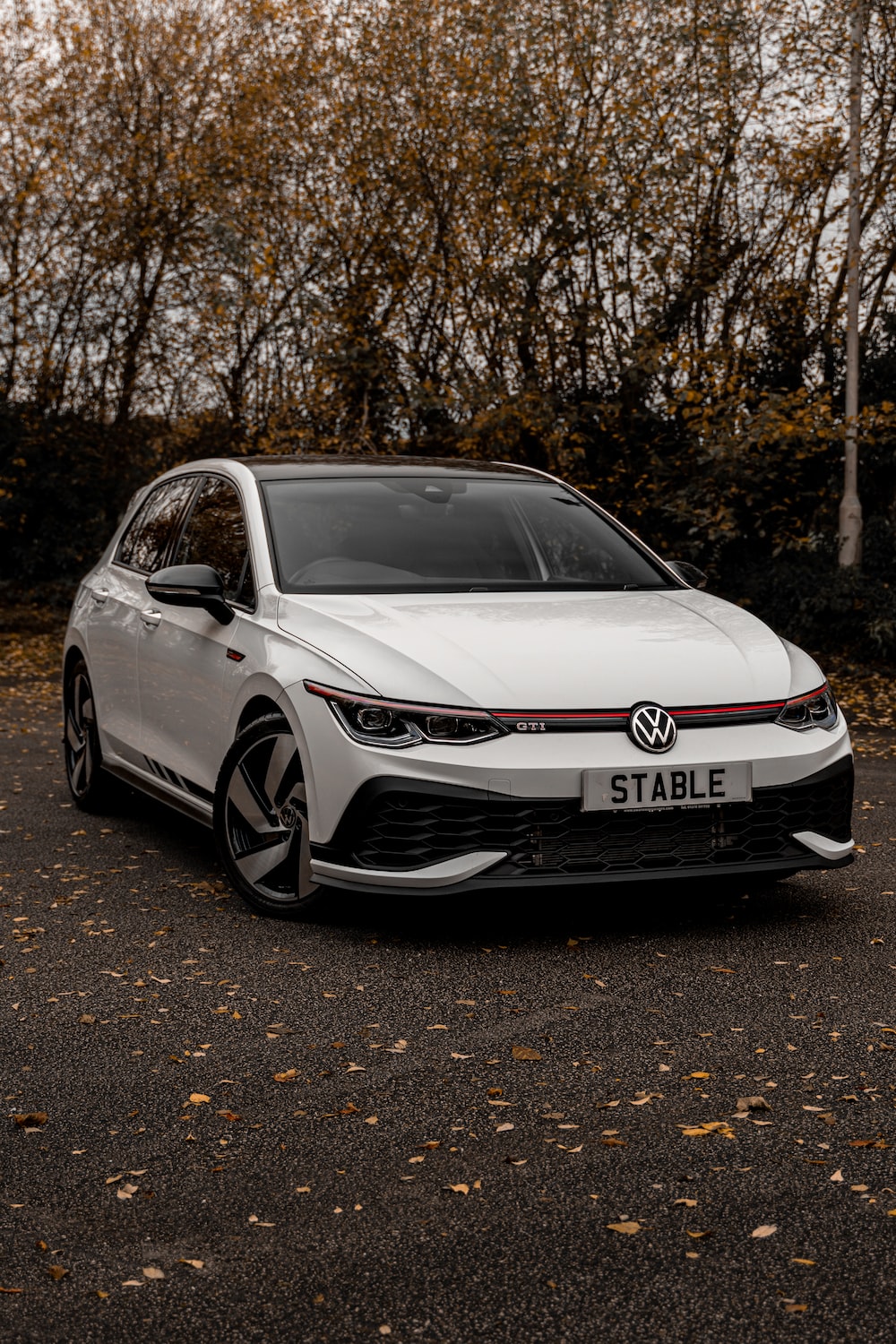A white car parked on a road photo