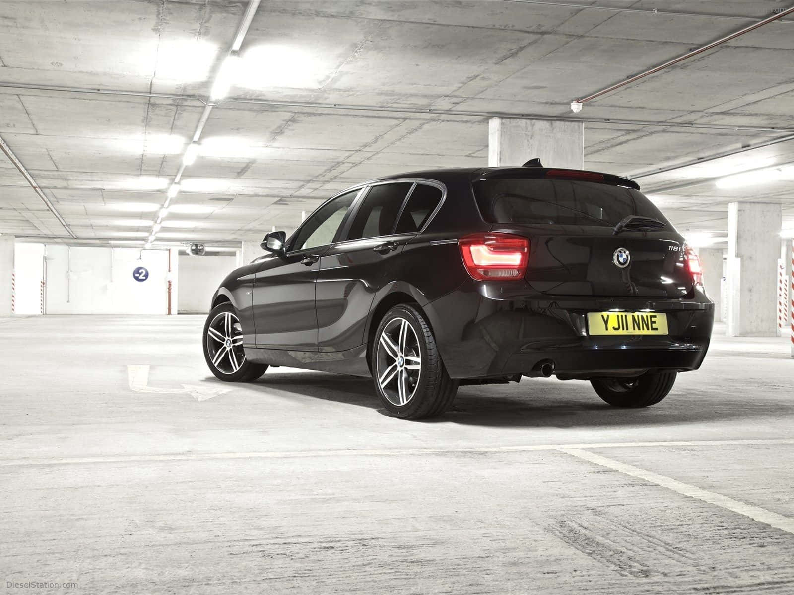 Download Sleek and Stylish BMW 1 Series in Action Wallpaper