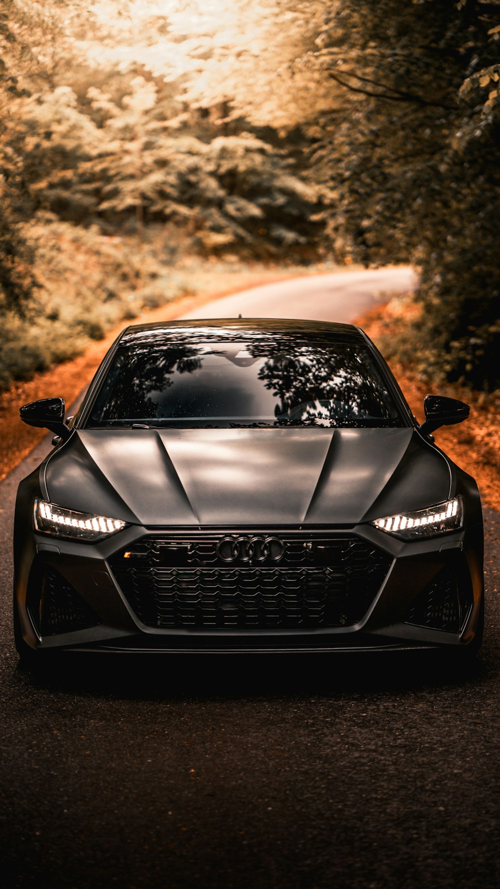 Black audi a 4 on road during daytime photo