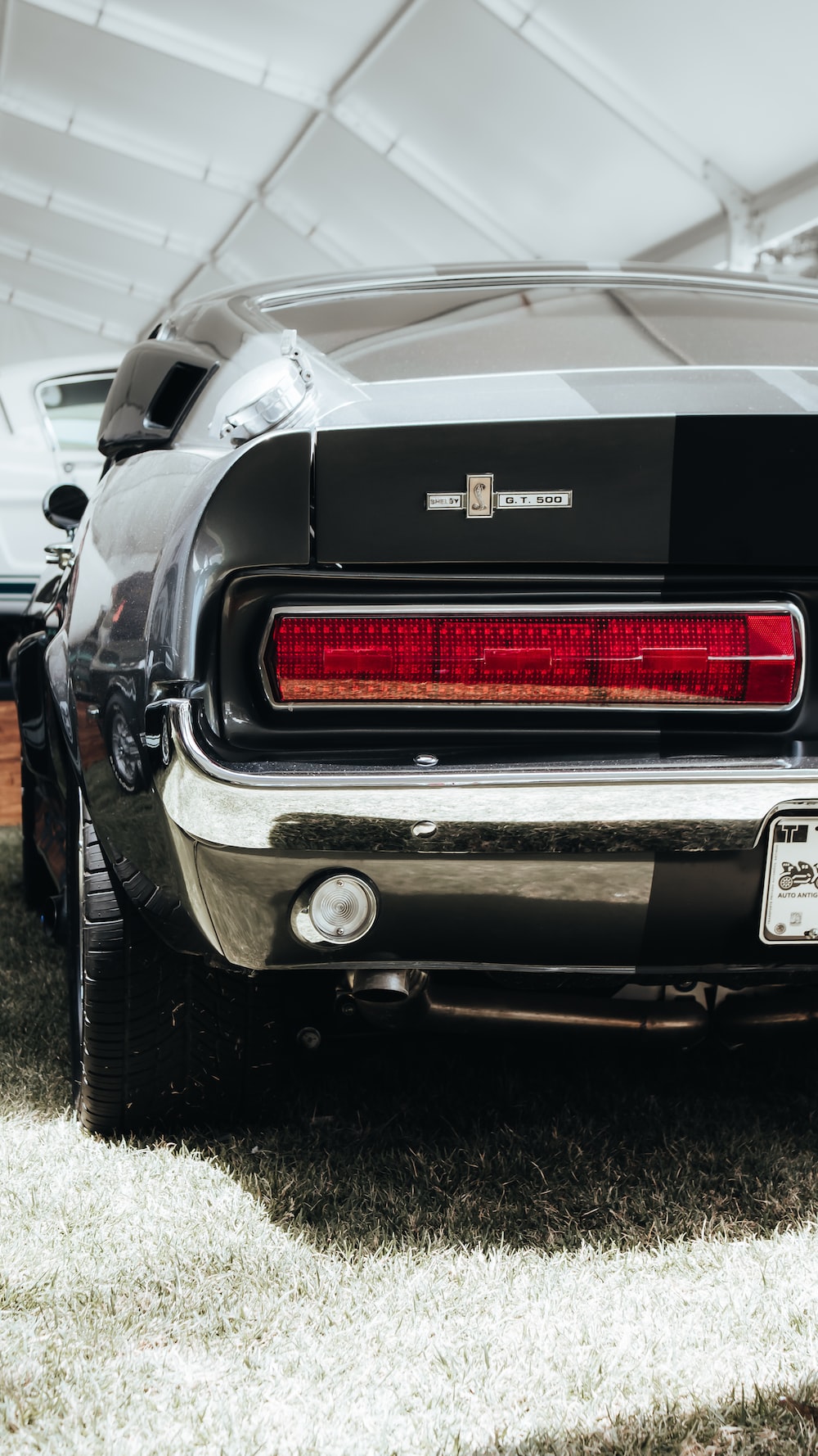 The back end of a car parked under a tent photo