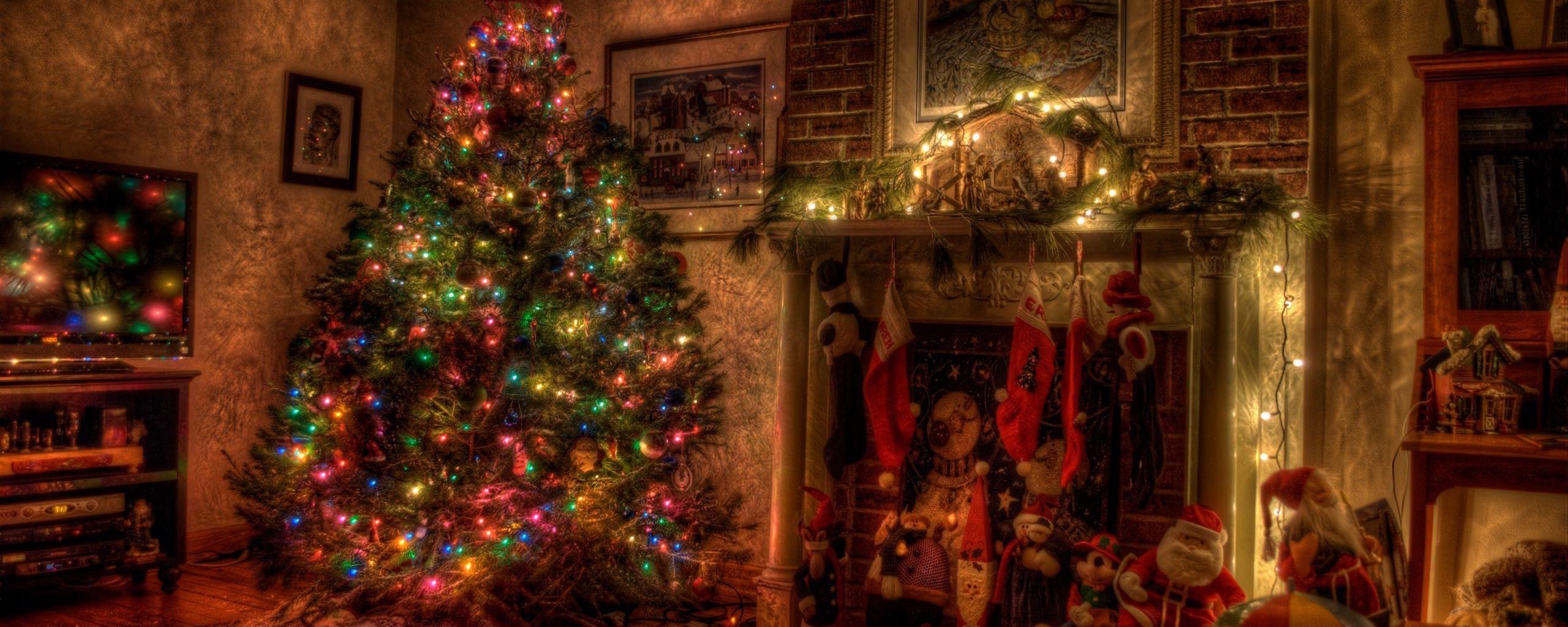 Download wallpaper 2560x1024 tree, christmas, holiday, garland, fireplace, toys, stockings ultrawide monitor HD background