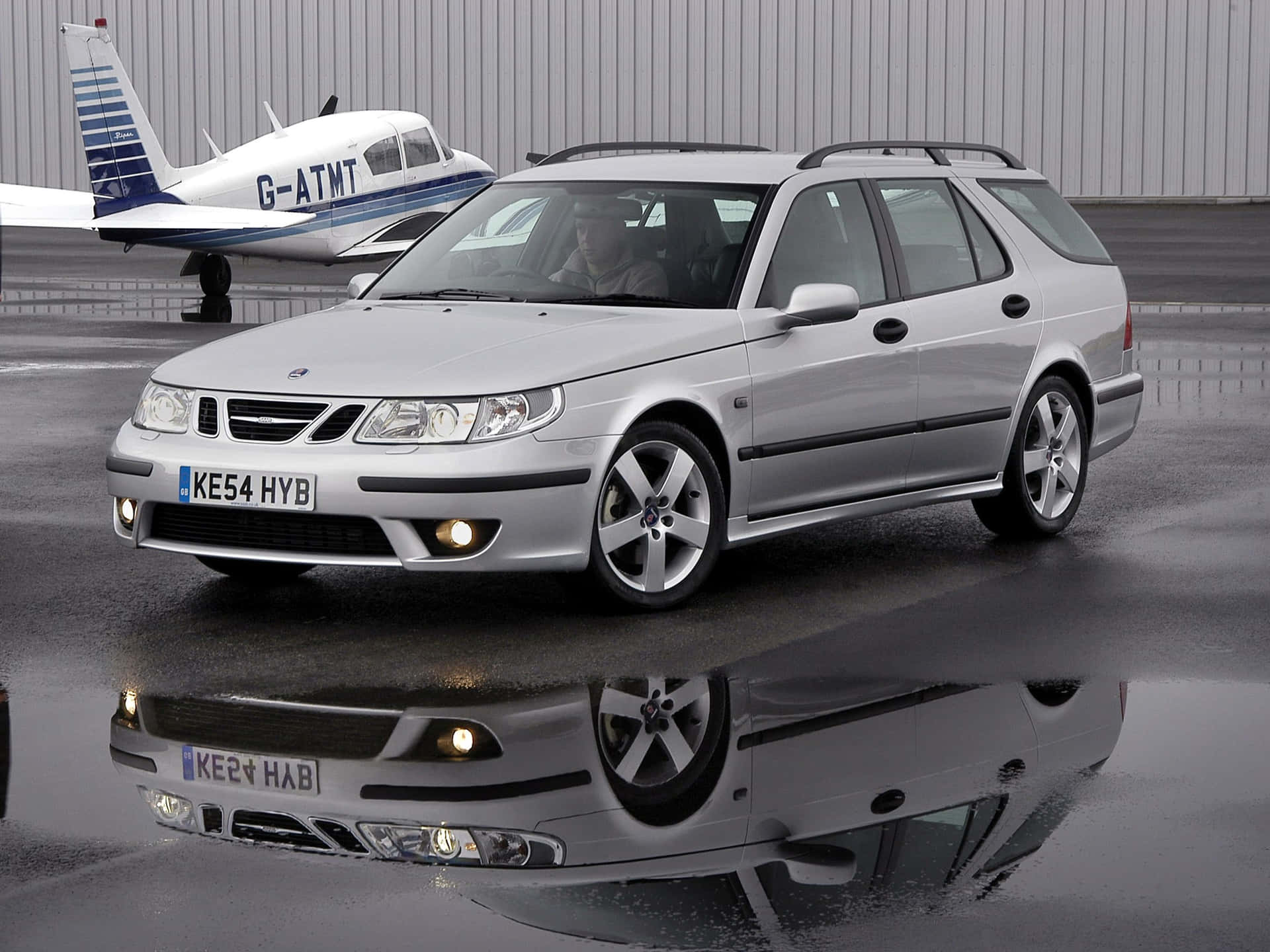 Download Captivating Saab 9 5 In Motion Wallpaper