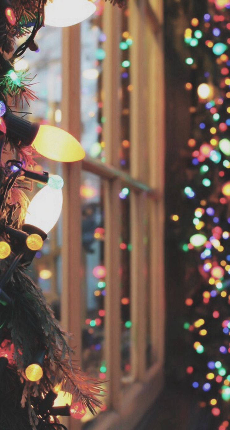Download Illuminate your Christmas with a festive display of lights for your iPhone! Wallpaper