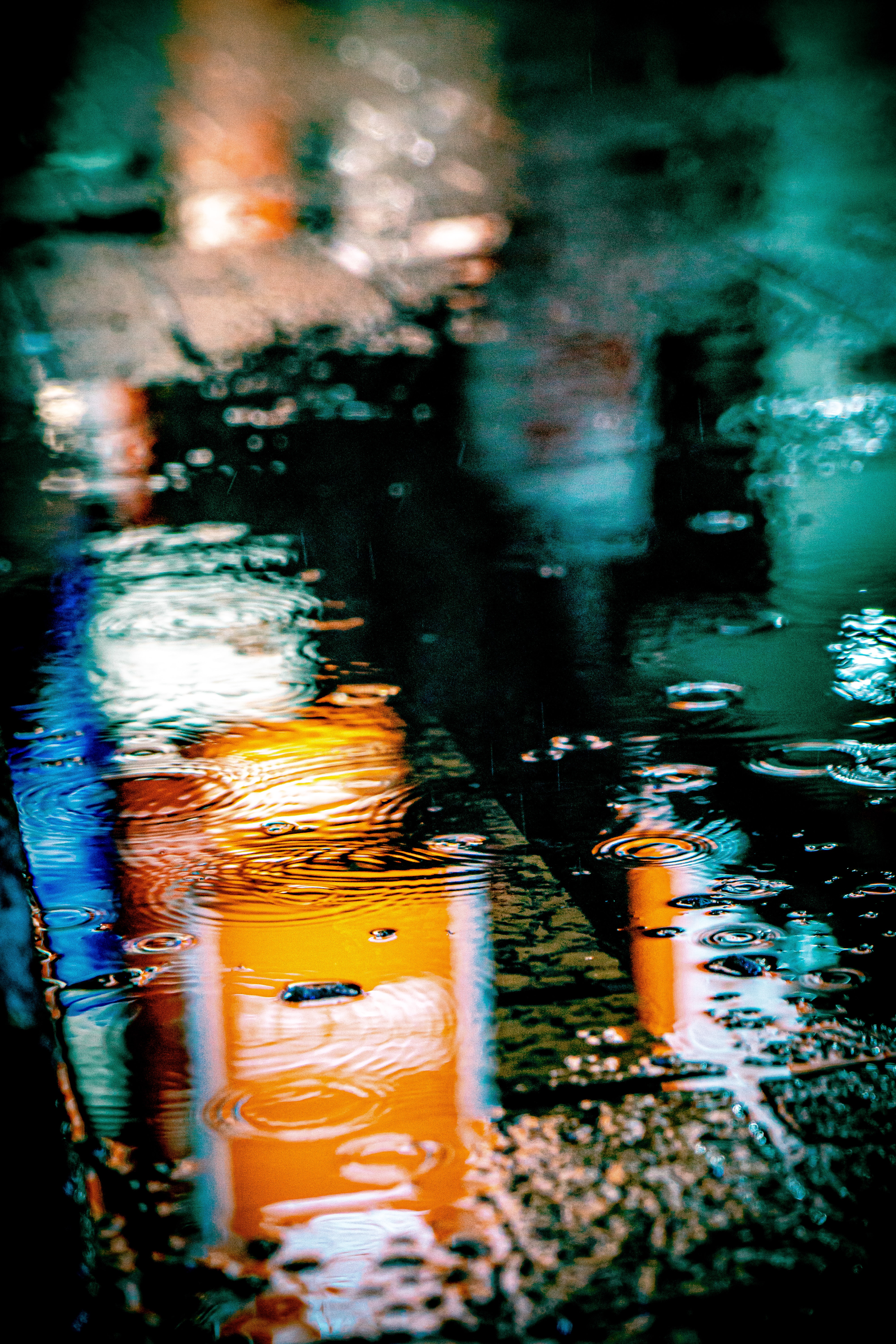Download wallpaper 4000x6000 puddle, rain, drops, neon, reflection, lights HD background