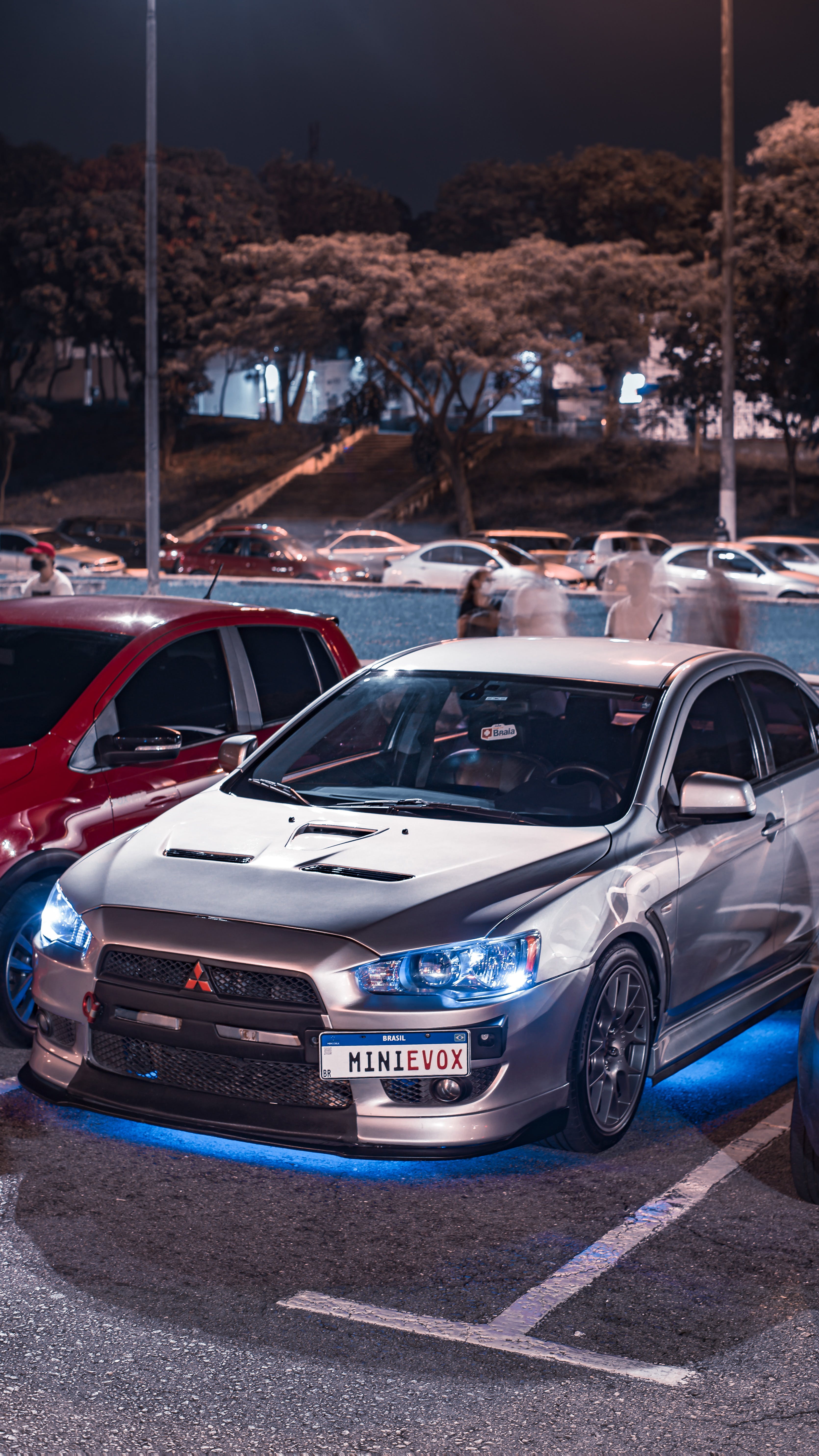 Modified Mitsubishi Lancer Evo Standing on the Race Track · Free